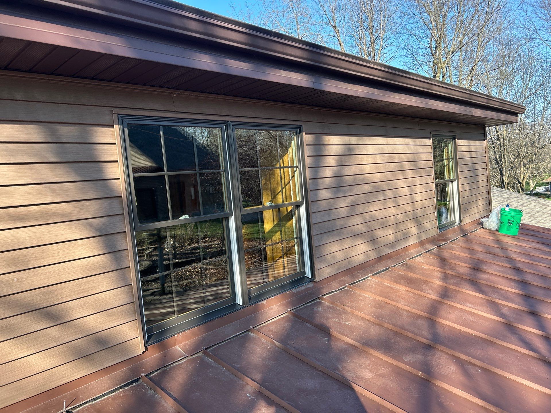 Pella Window installation using Pella Lifestyle wood/Aluminum window by United Windows and Siding LLC