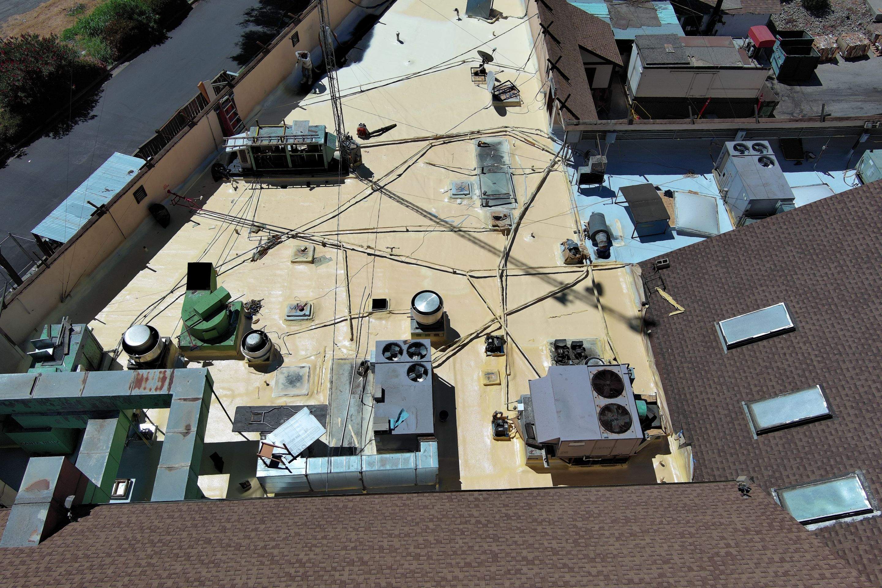 Spray foam and coatings using General Coatings acrylic coatings and spray foam by Straight Edge Roofing Inc