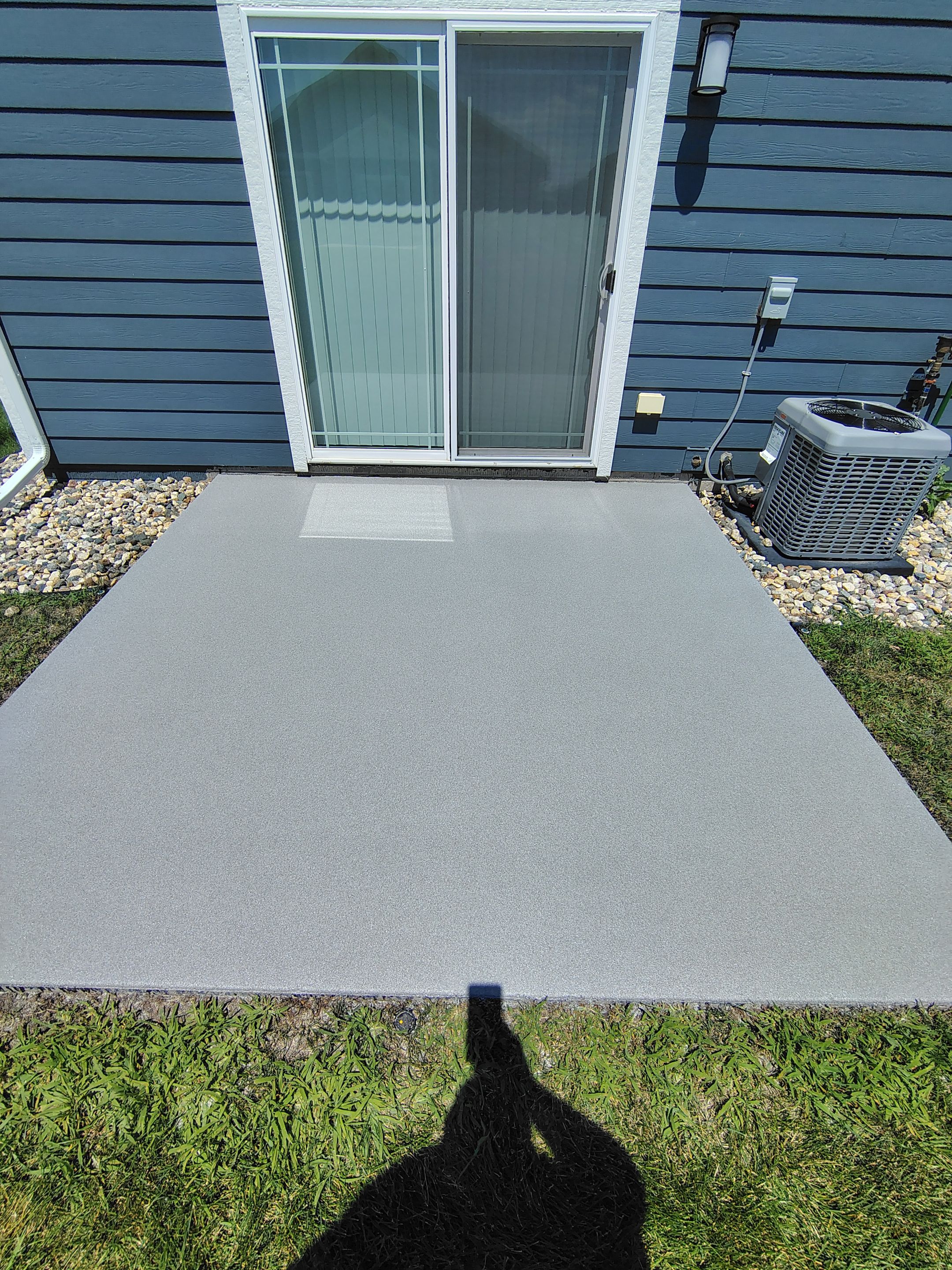 Custom Epoxy Garage Floor and Patio Coating in Sioux Falls by Select Painting, Coatings & Garage Cabinets