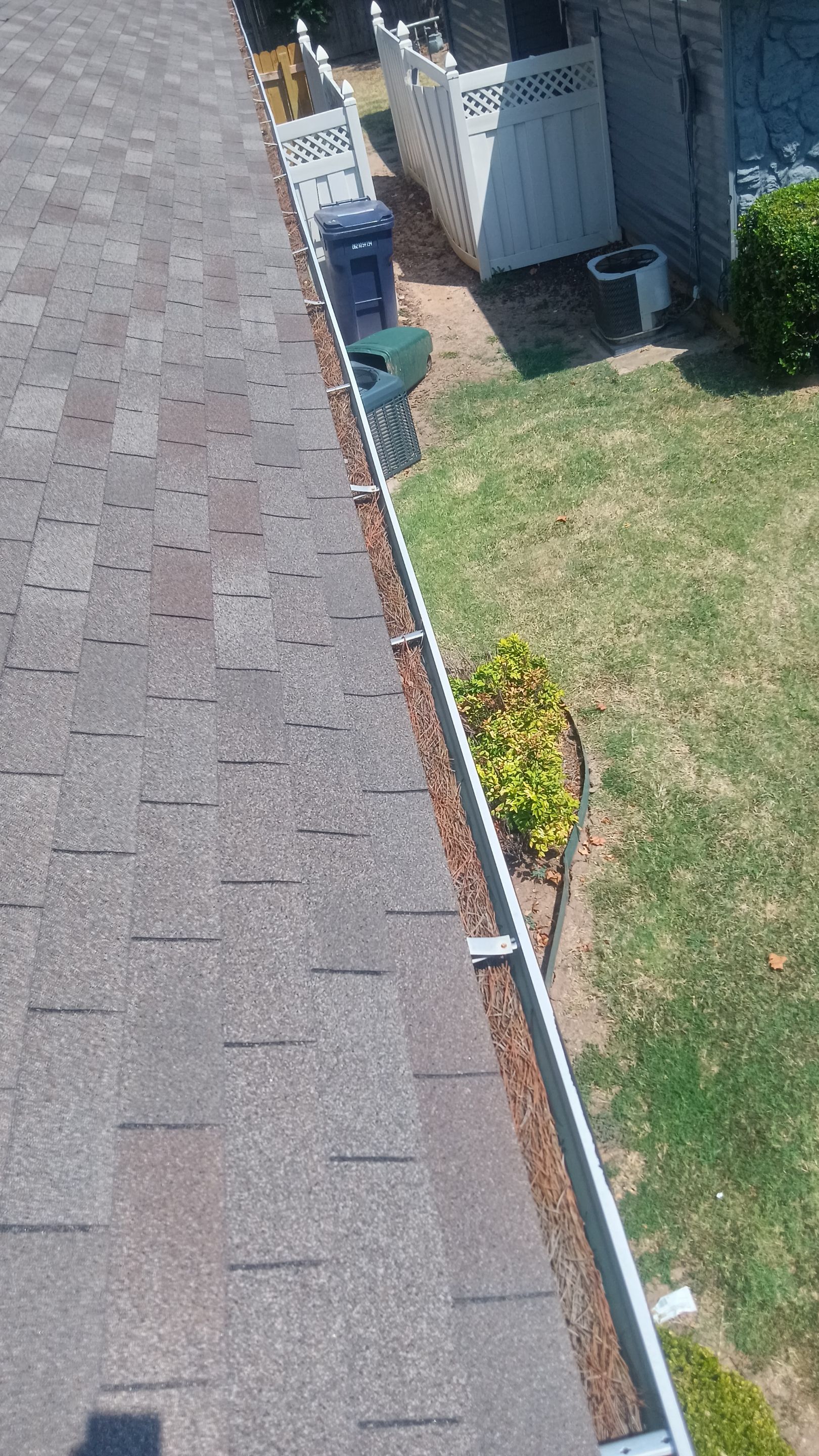 Commercial gutter cleaning Oklahoma City before photo with filled gutters