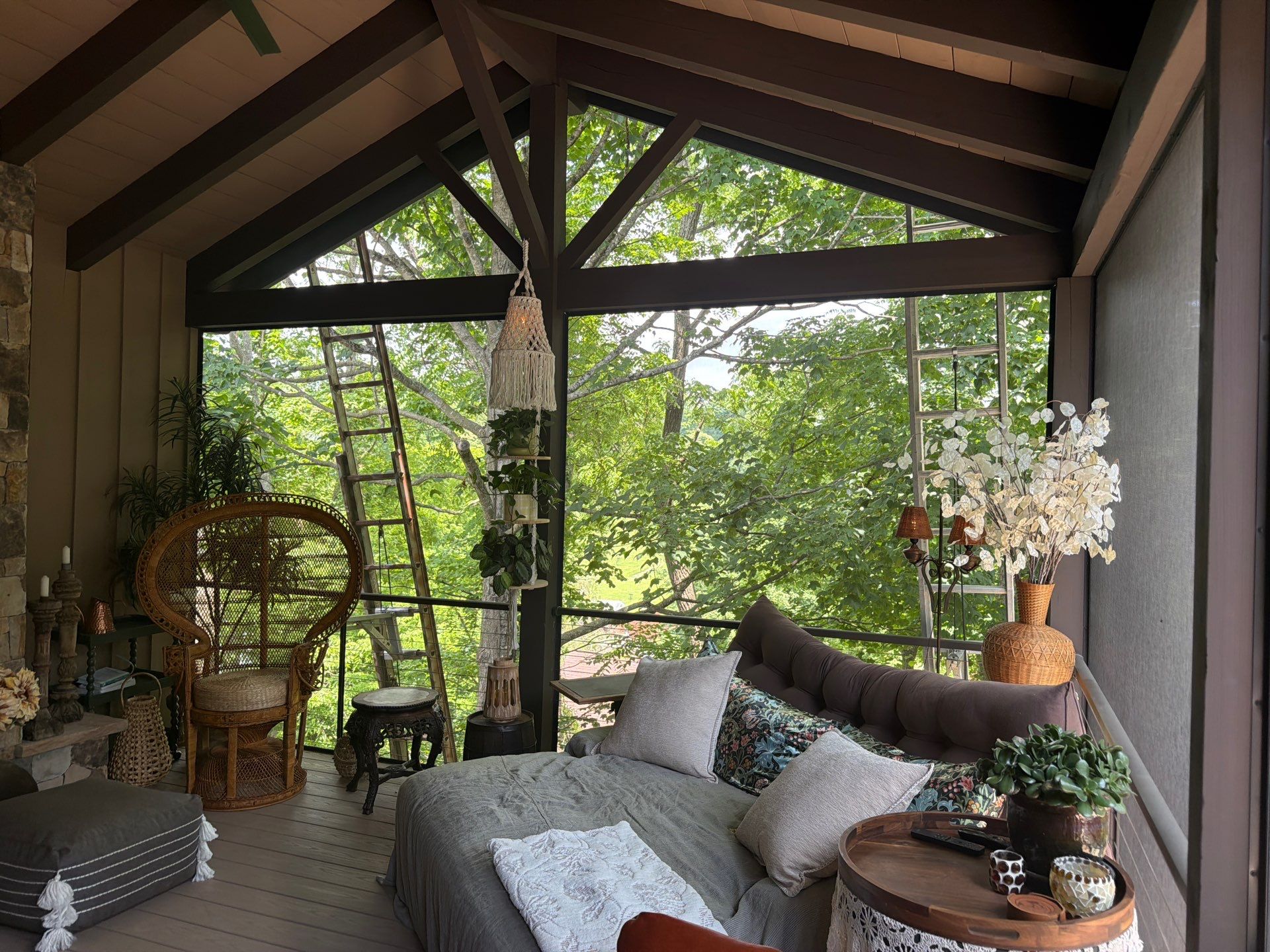 Custom Composite Deck with Stone Fireplace and Modern Cable Railing by Walnut Hollow Decks & Outdoor Living