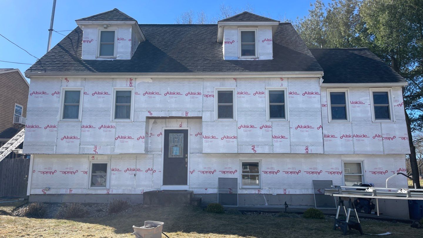 Complete Exterior Renovation with New Siding & Gutters   by Sensible Home Solutions