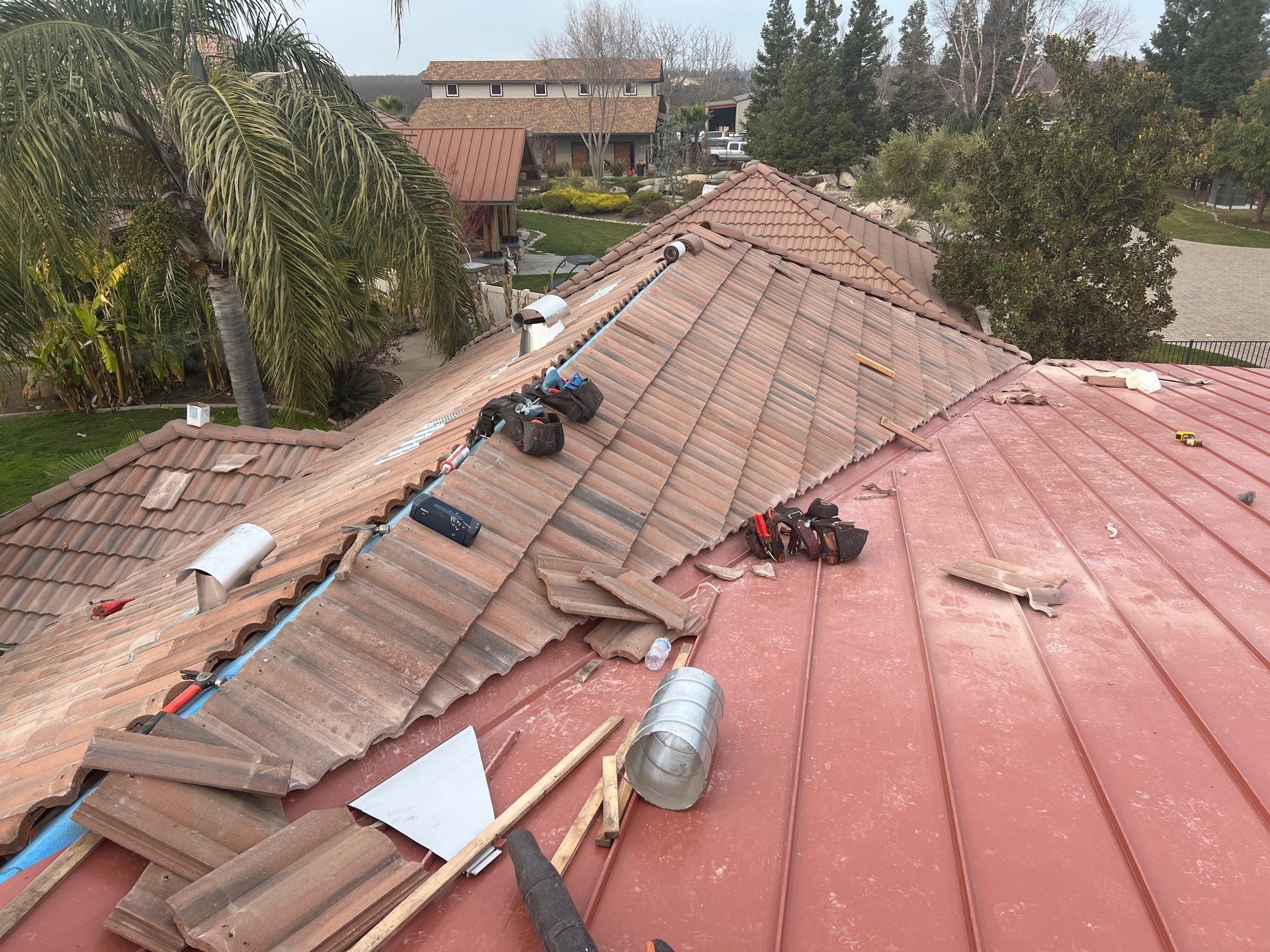 Tile, Metal, and TPO roofing project (new construction) by Straight Edge Roofing Inc