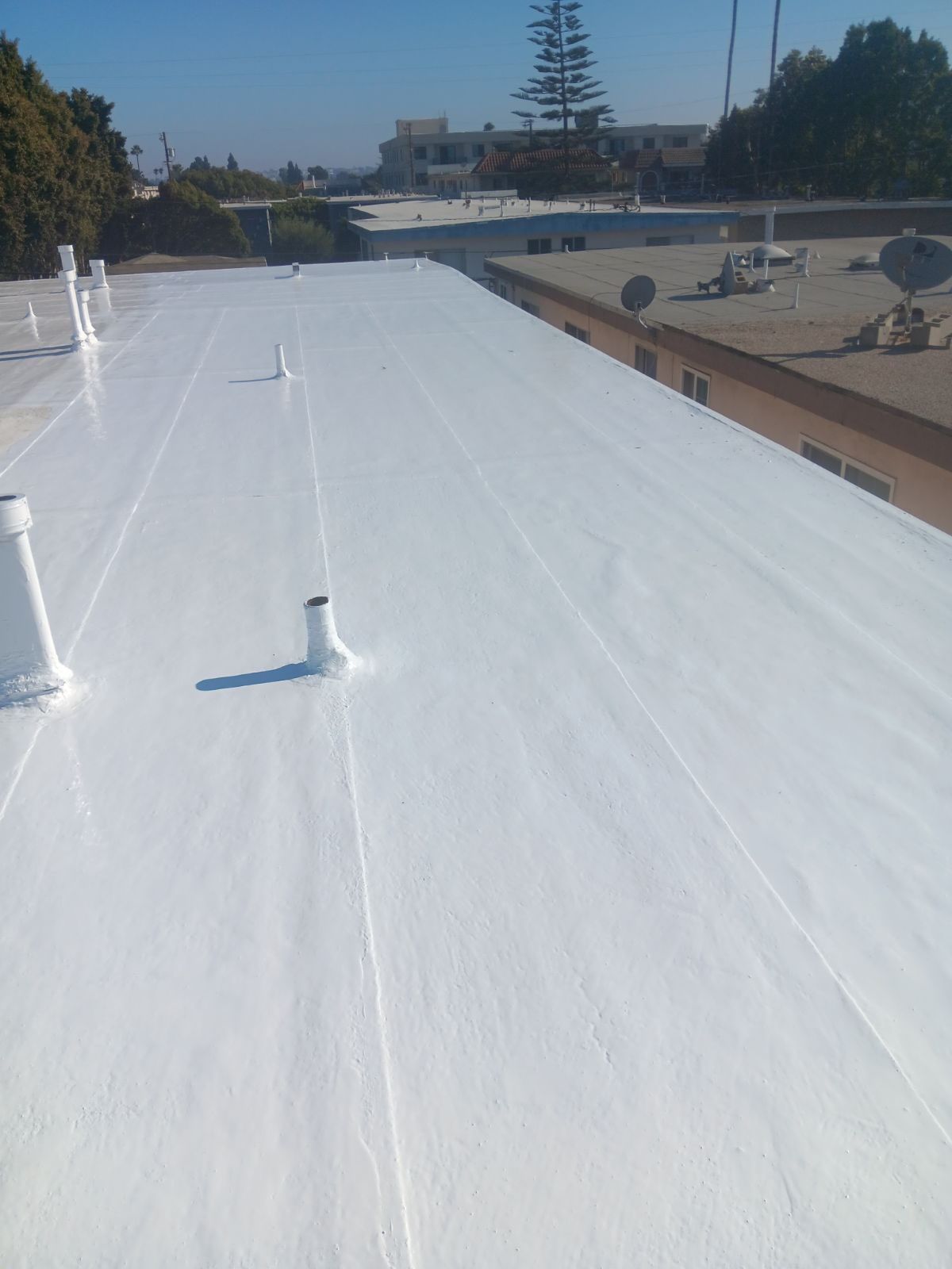 Commercial Roofing Installation using Silicone Coating by Hull Brothers Roofing