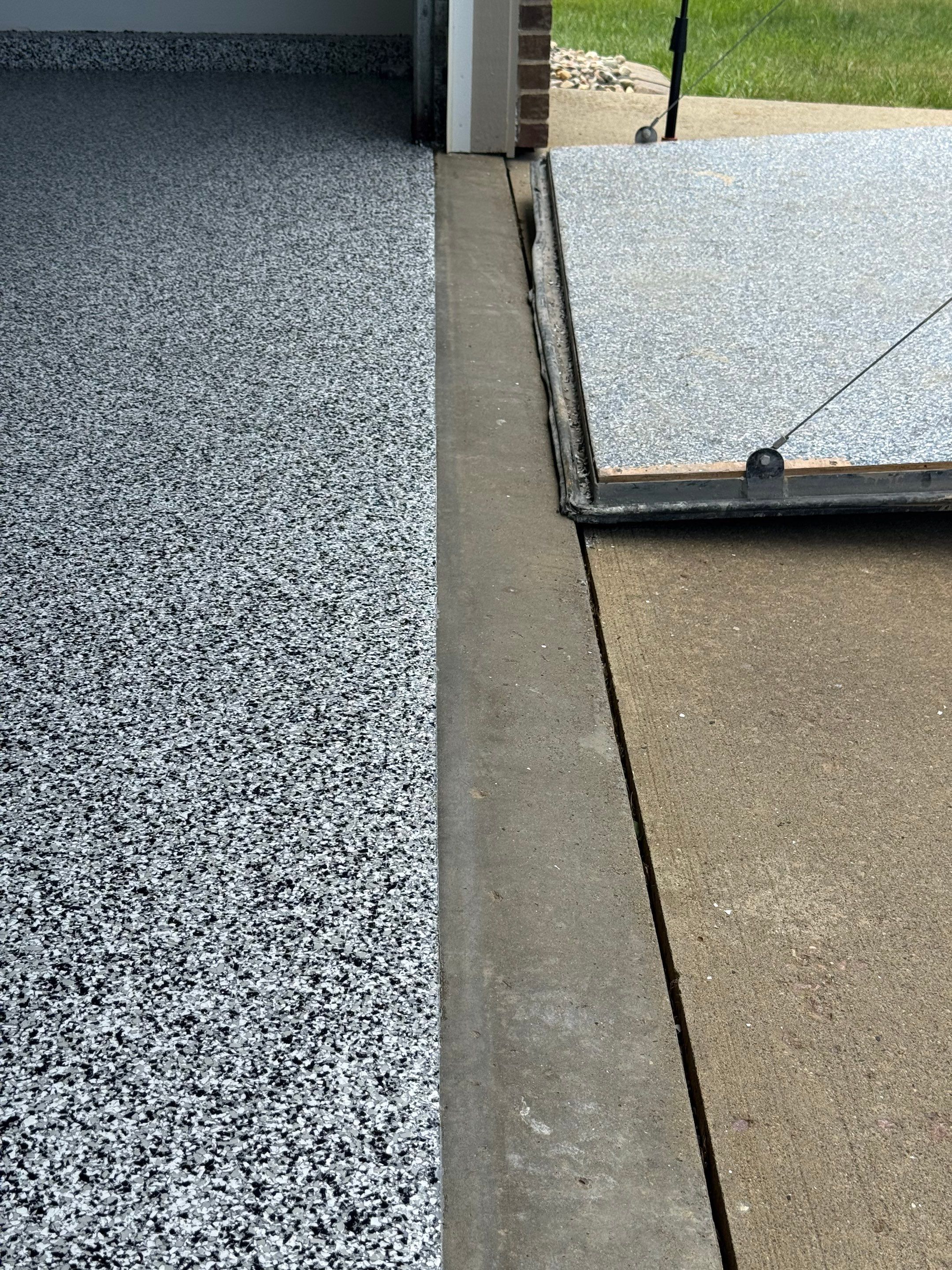 Full Garage Floor and Basement Stair Epoxy Coating in Sioux Falls by Select Painting, Coatings & Garage Cabinets