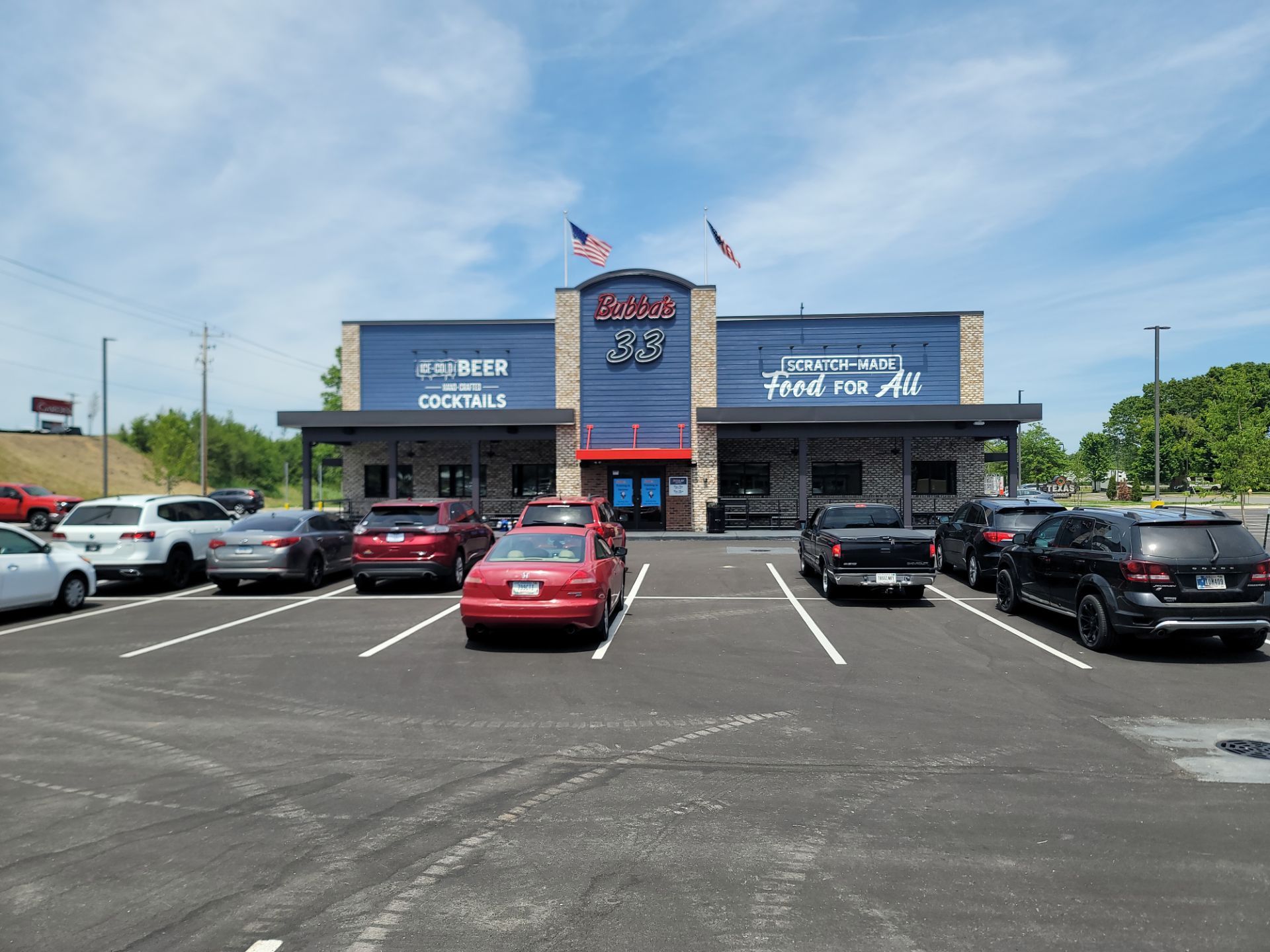 Bubba's 33 Exterior Vinyl Graphic and Painted Signage Installation by Hayes Design co