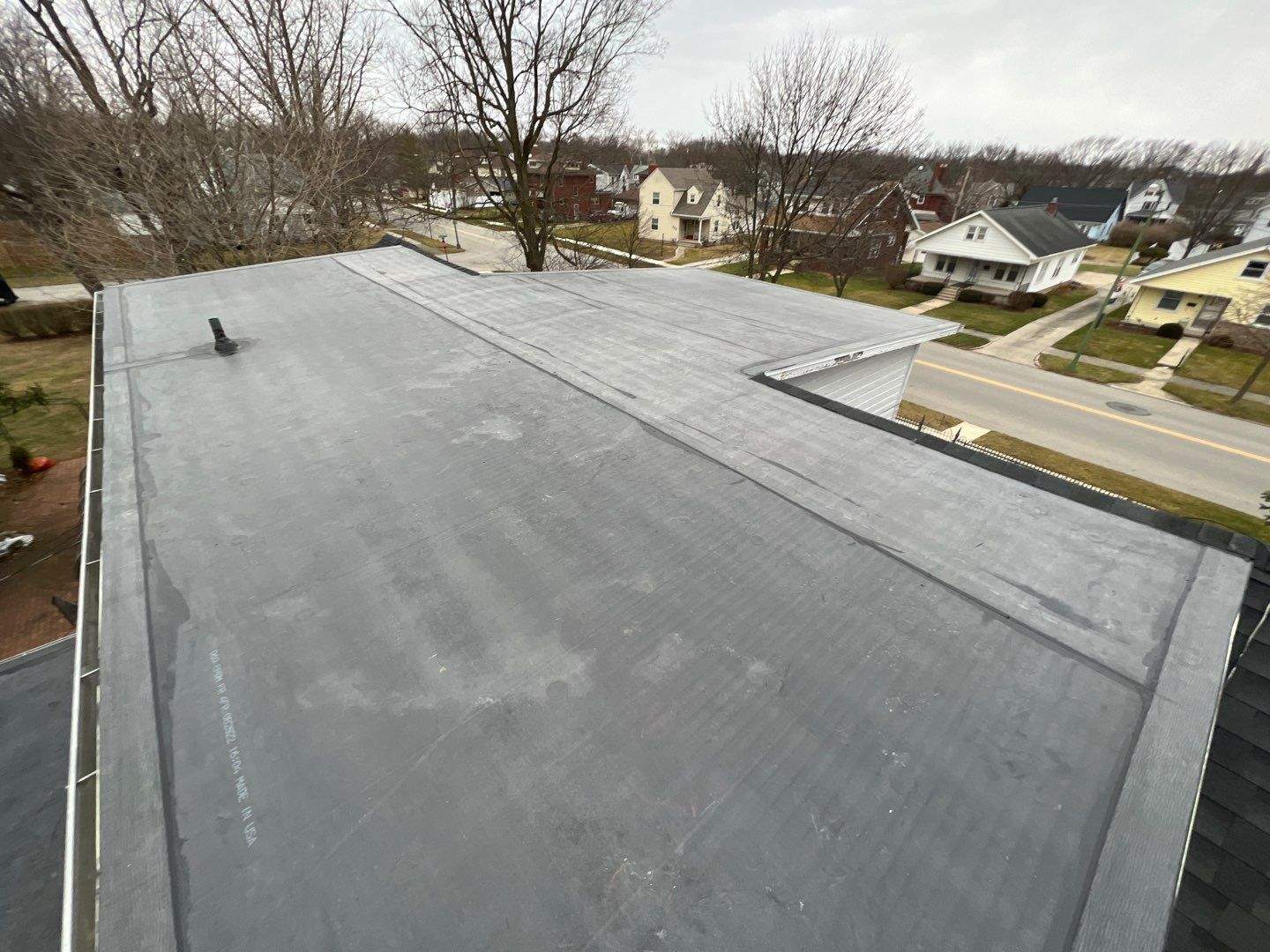 Residential Roofing Installation using 60 mil rubber roof by Nitro Roofing and Construction