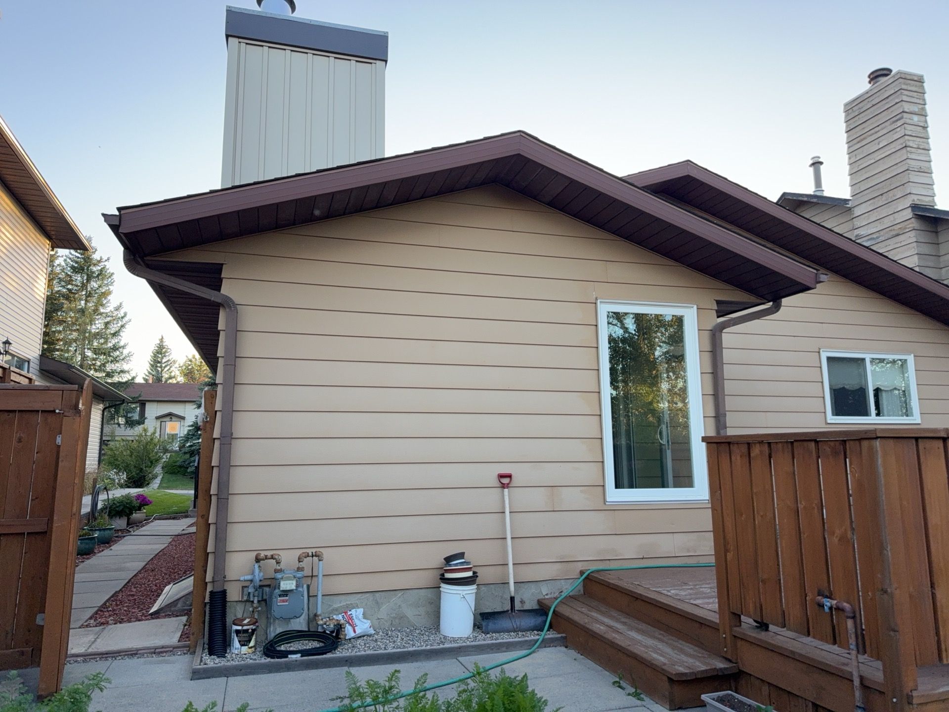 Calgary Chimney Chase Reconstruction and Exterior Siding Replacement by Smart Home Building Systems Ltd.