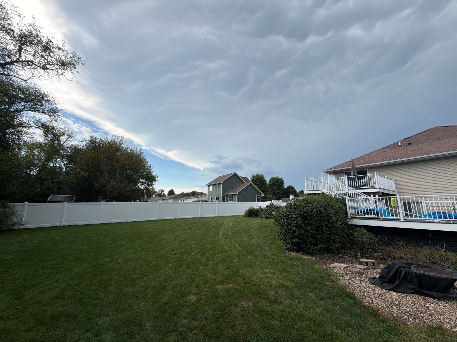 White Vinyl Privacy Fence Installation in Raymond, IA by Perfect Picket Fence and Stain