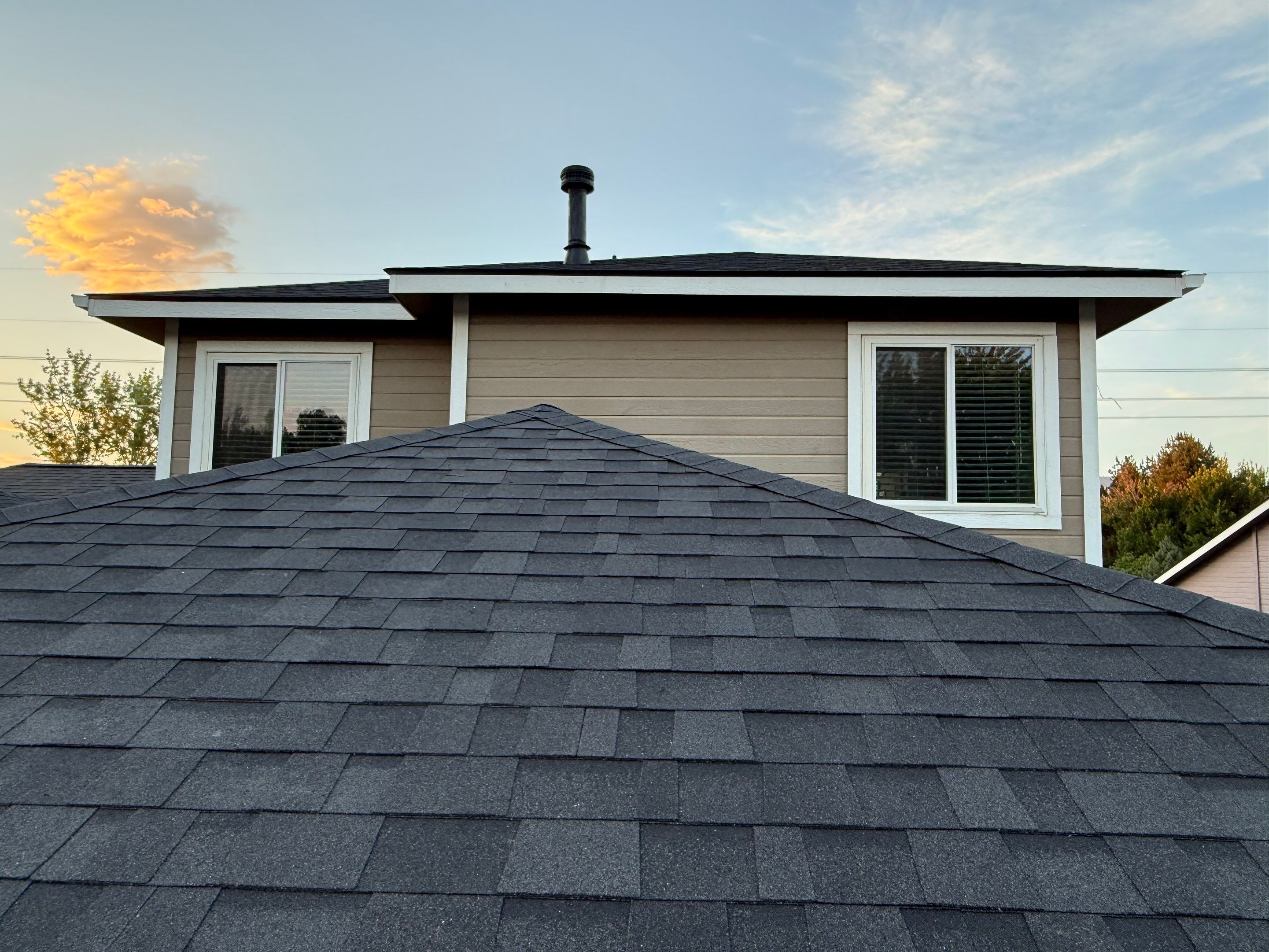 Residential Roof Replacement and Seamless Gutter Installation in Boise by Olive Roofing