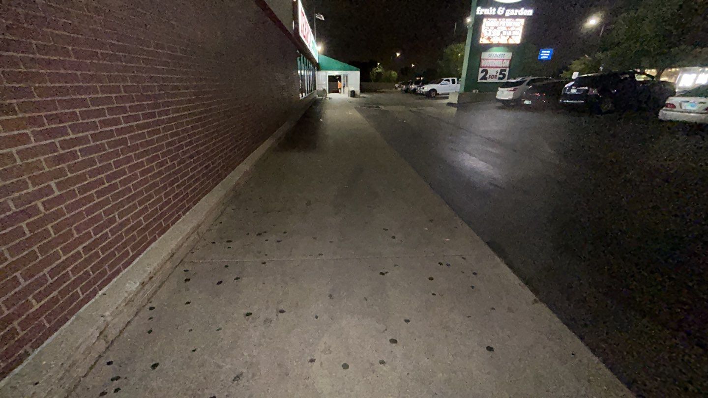 Concrete sidewalk cleaning and degreasing by Northern Power Washing LLC.