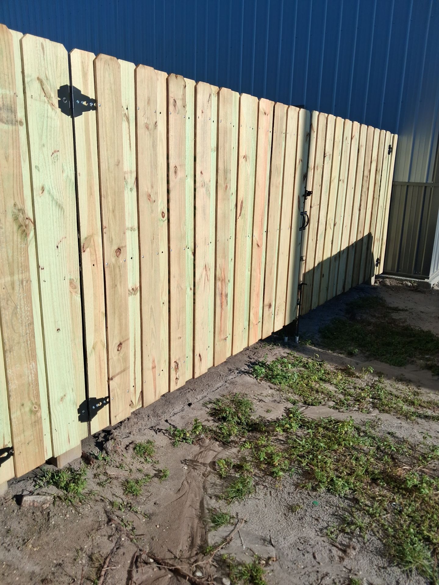 Pressure-Treated Wood Privacy Fence and Gate Installation in North Port by True Fence LLC