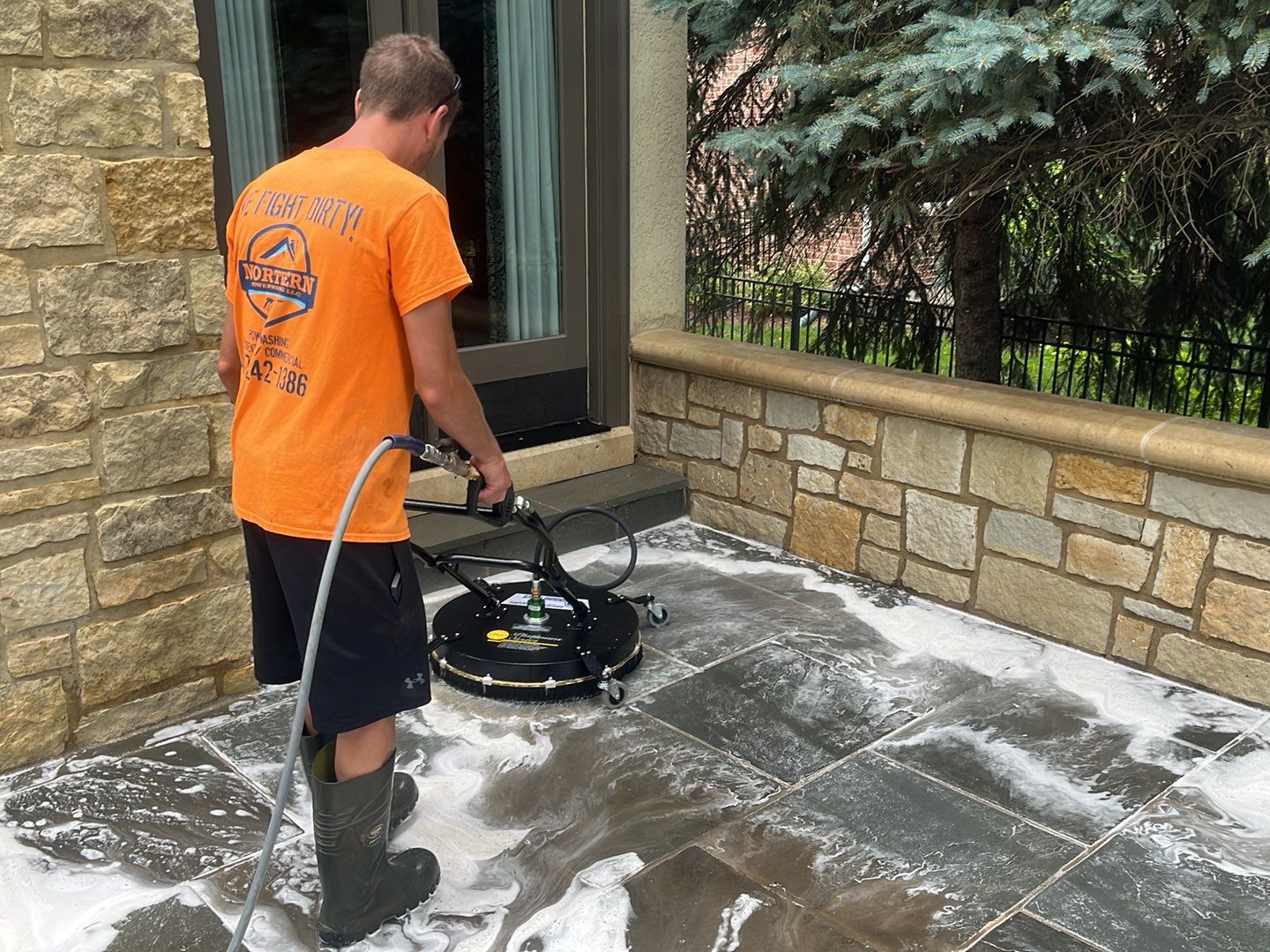 Northbrook, IL stucco home soft wash and stone cleaning by Northern Power Washing LLC.