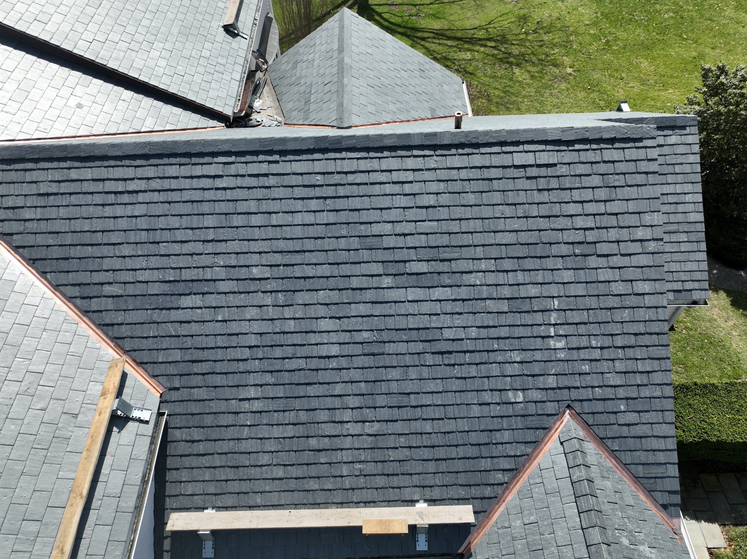 Residential Roofing Installation using Vermont Slate by A Plus Exterior