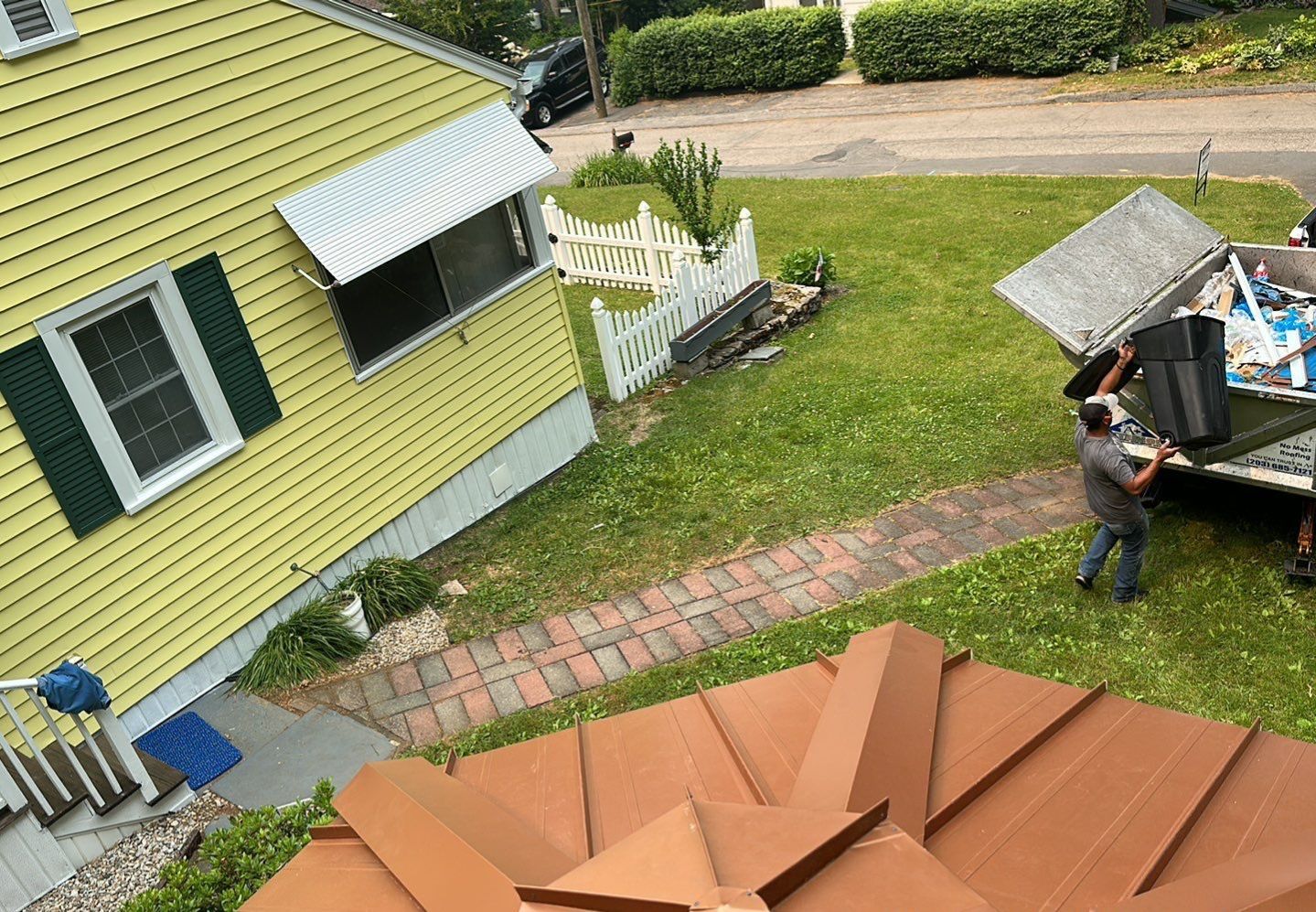 Residential Roofing Installation using Copper Penny Metal Roof by A Plus Exterior