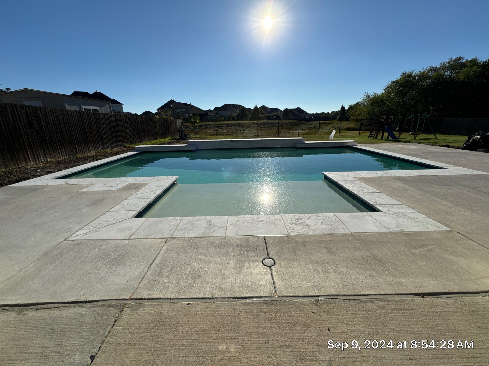 Crisp Geometric Pool with Sun Shelf by Pinnacle Pools and Spas - DFW