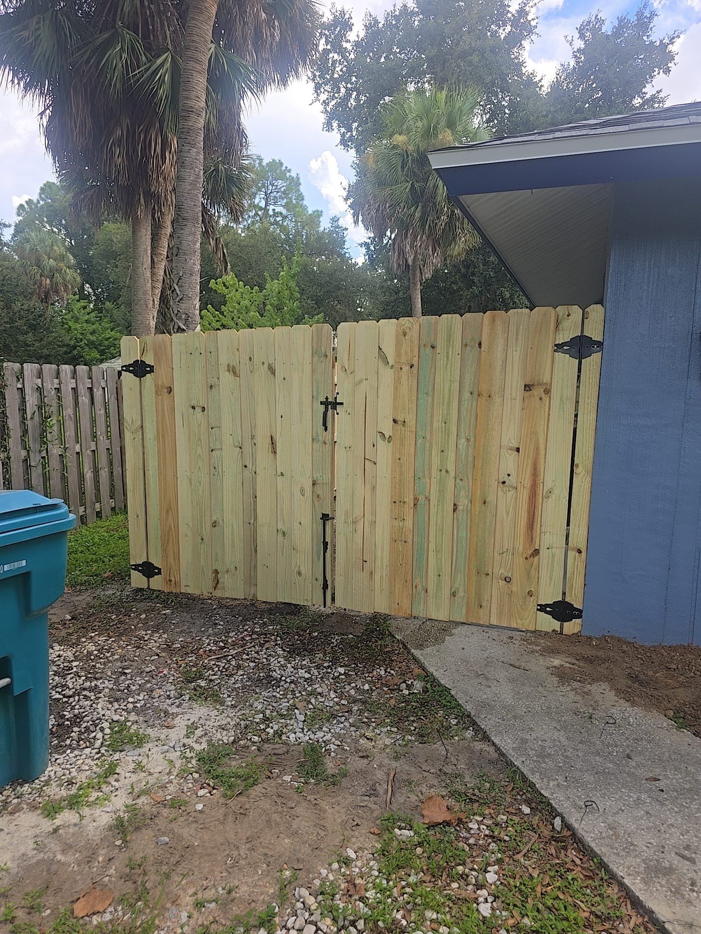 Wood Privacy Fence Installation with Double Gate in Port Charlotte by True Fence LLC