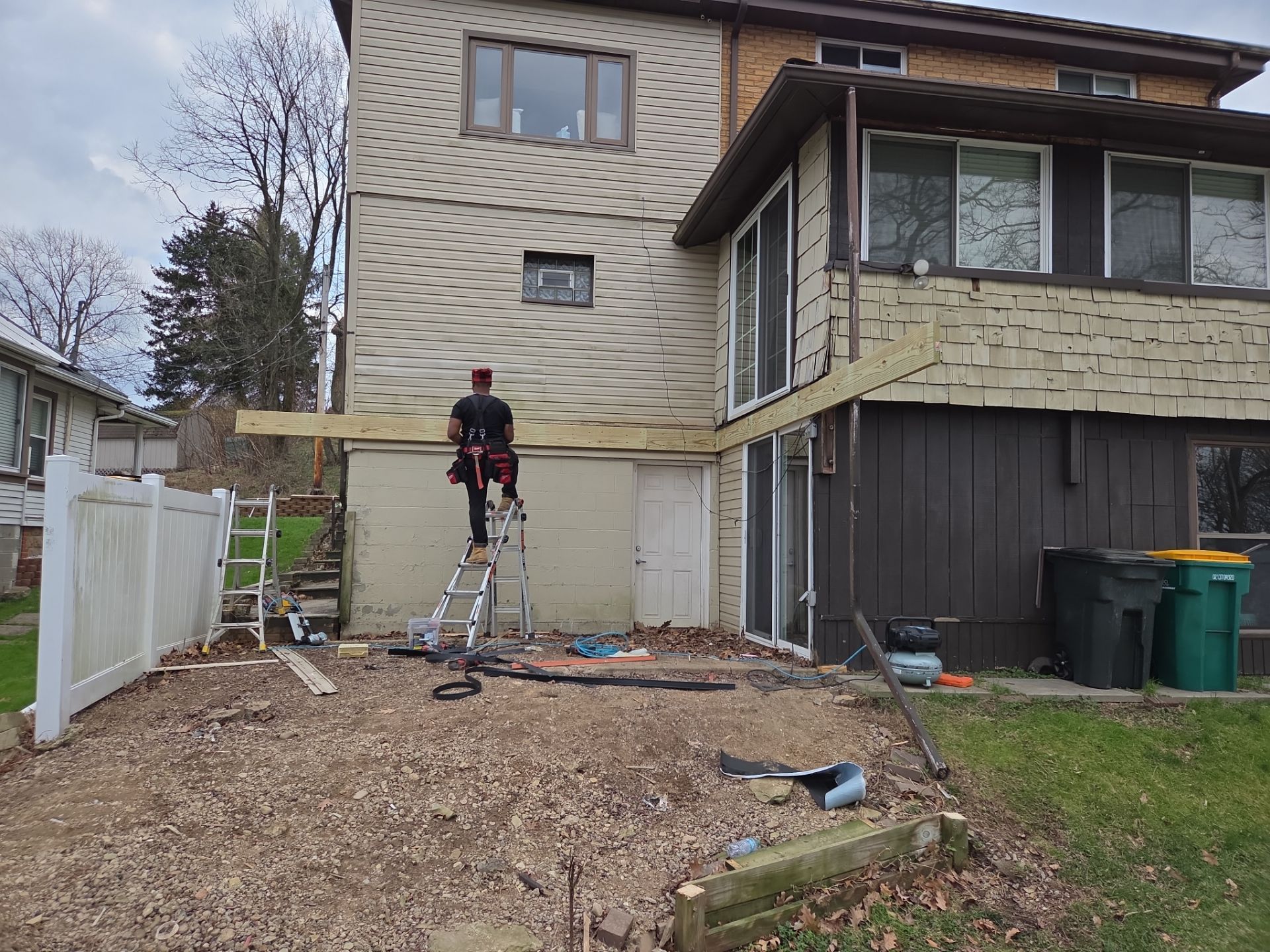 Custom Composite Deck and Wood-Plank Stamped Concrete Patio in Pittsburgh by Cousins Roofing Siding & Decks