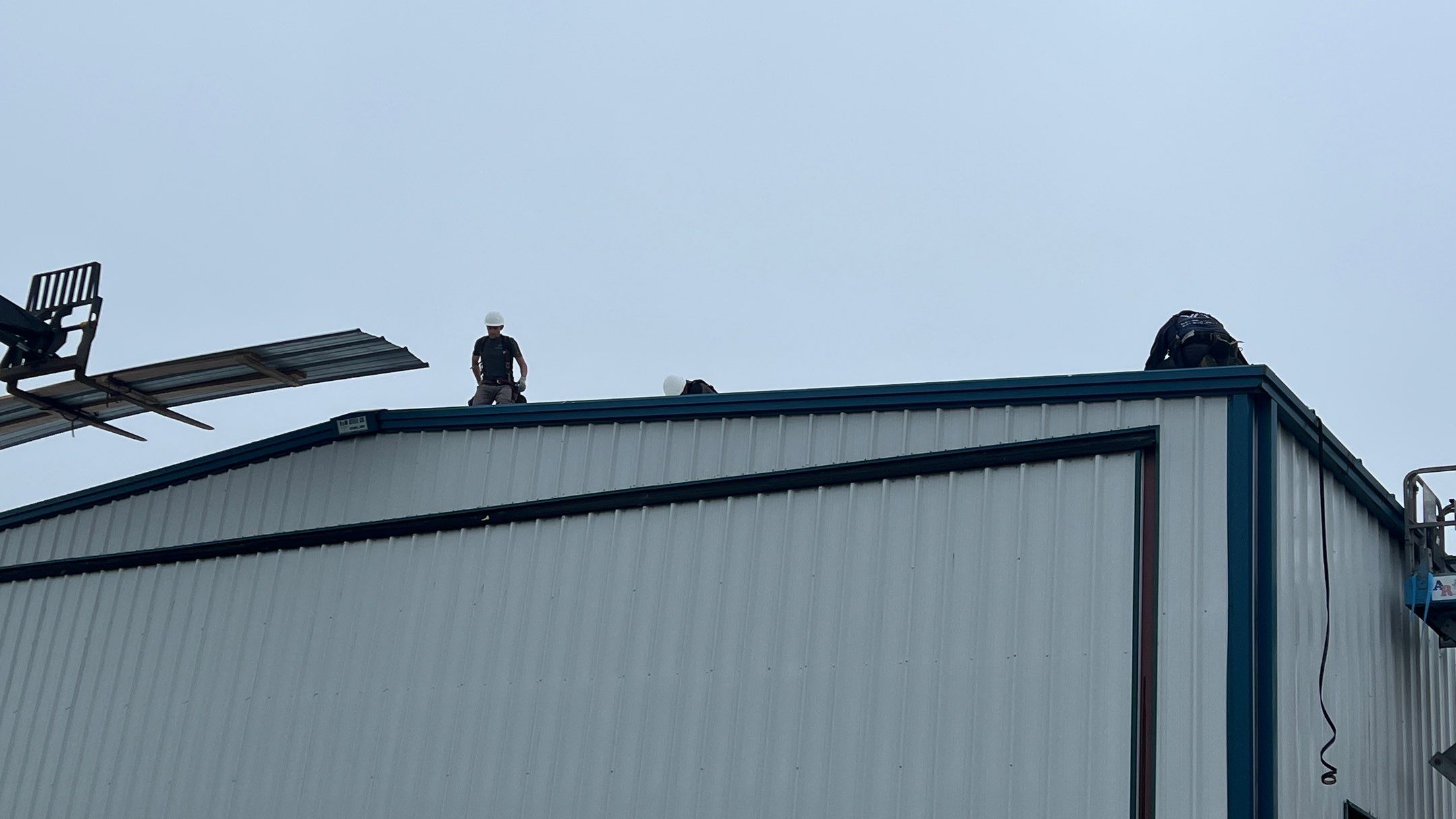 Airport Hanger Metal Roof Replacement and Insulation by Villegas Remodeling, LLC