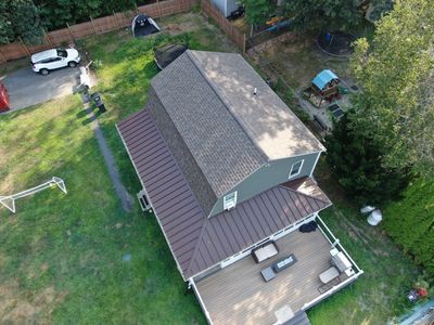 Full Roof Replacement & Farmers Porch Restoration – Asphalt + Standing Seam Metal