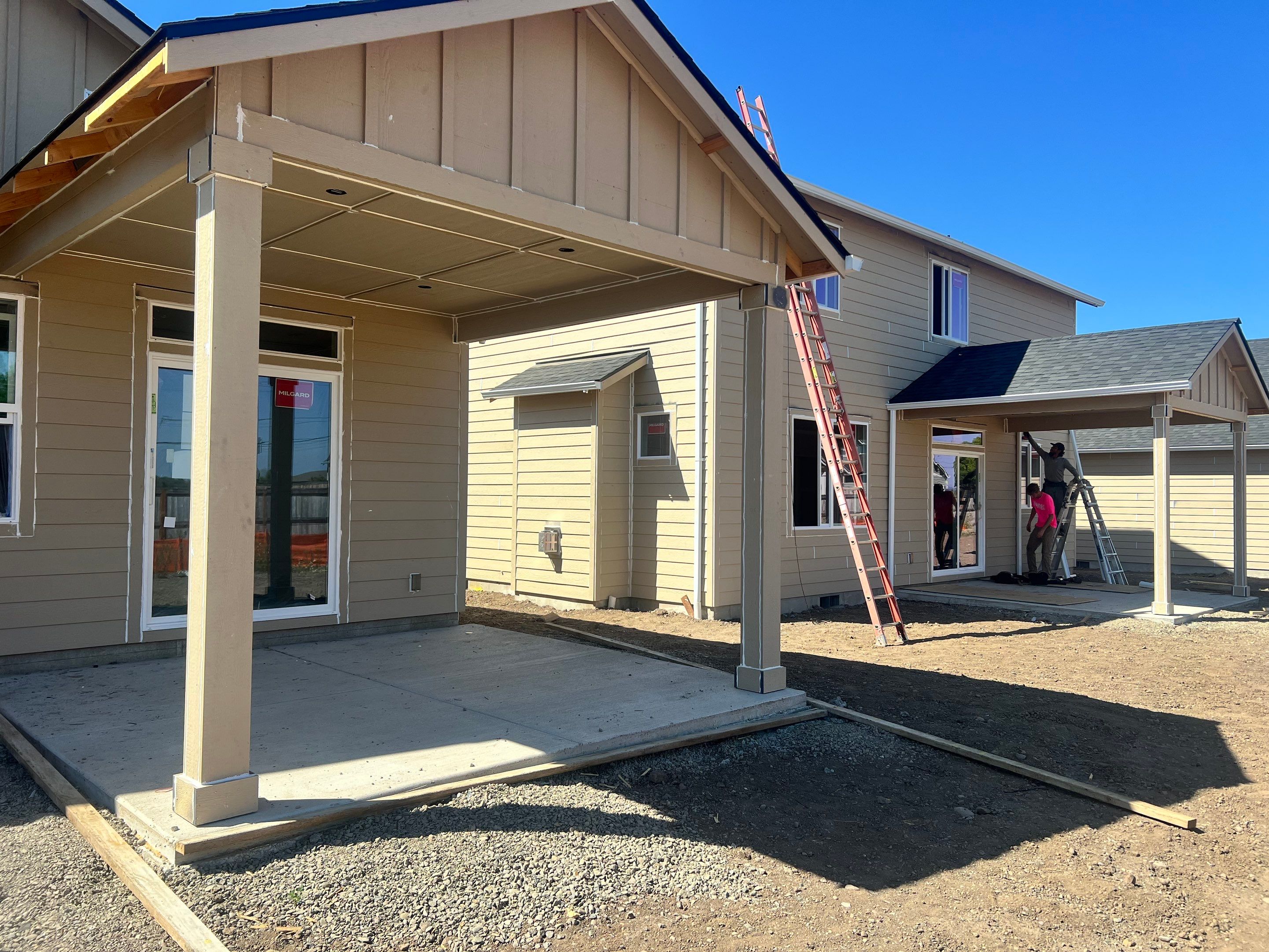 Continuous White Gutter and Downspout Installation for New Eugene Home by BEST Roofing & Waterproofing