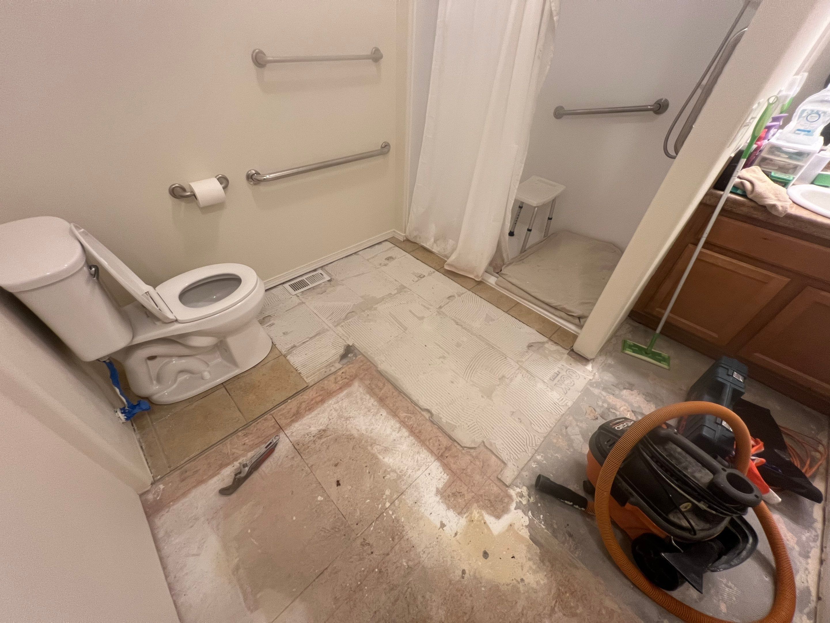 Bathroom flooring upgrade by Handyman State LLC
