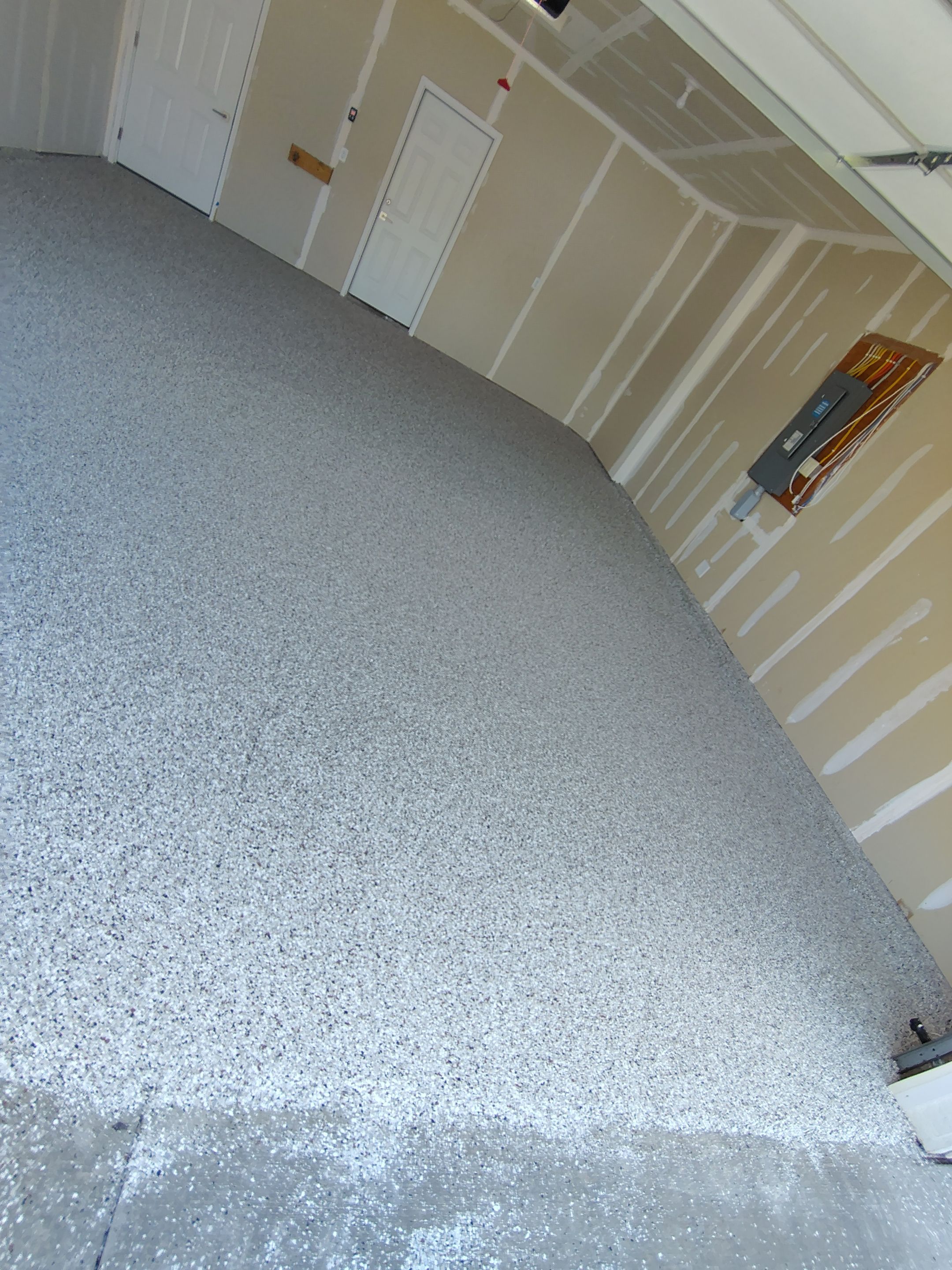 Custom Epoxy Garage Floor and Patio Coating in Sioux Falls by Select Painting, Coatings & Garage Cabinets
