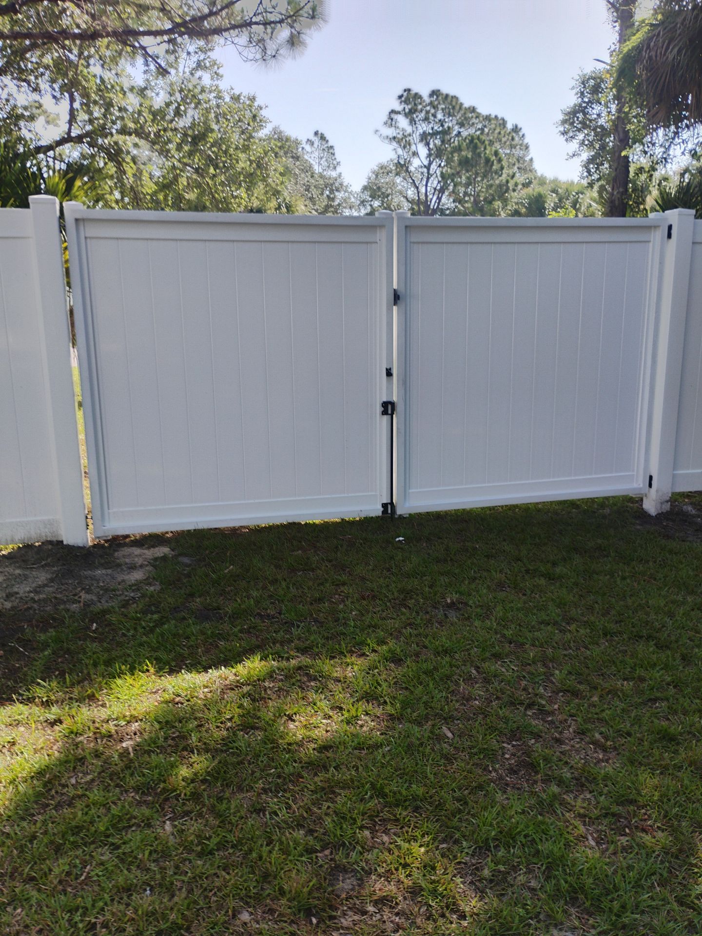 Vinyl Privacy Fence and Double Gate Installation in North Port by True Fence LLC
