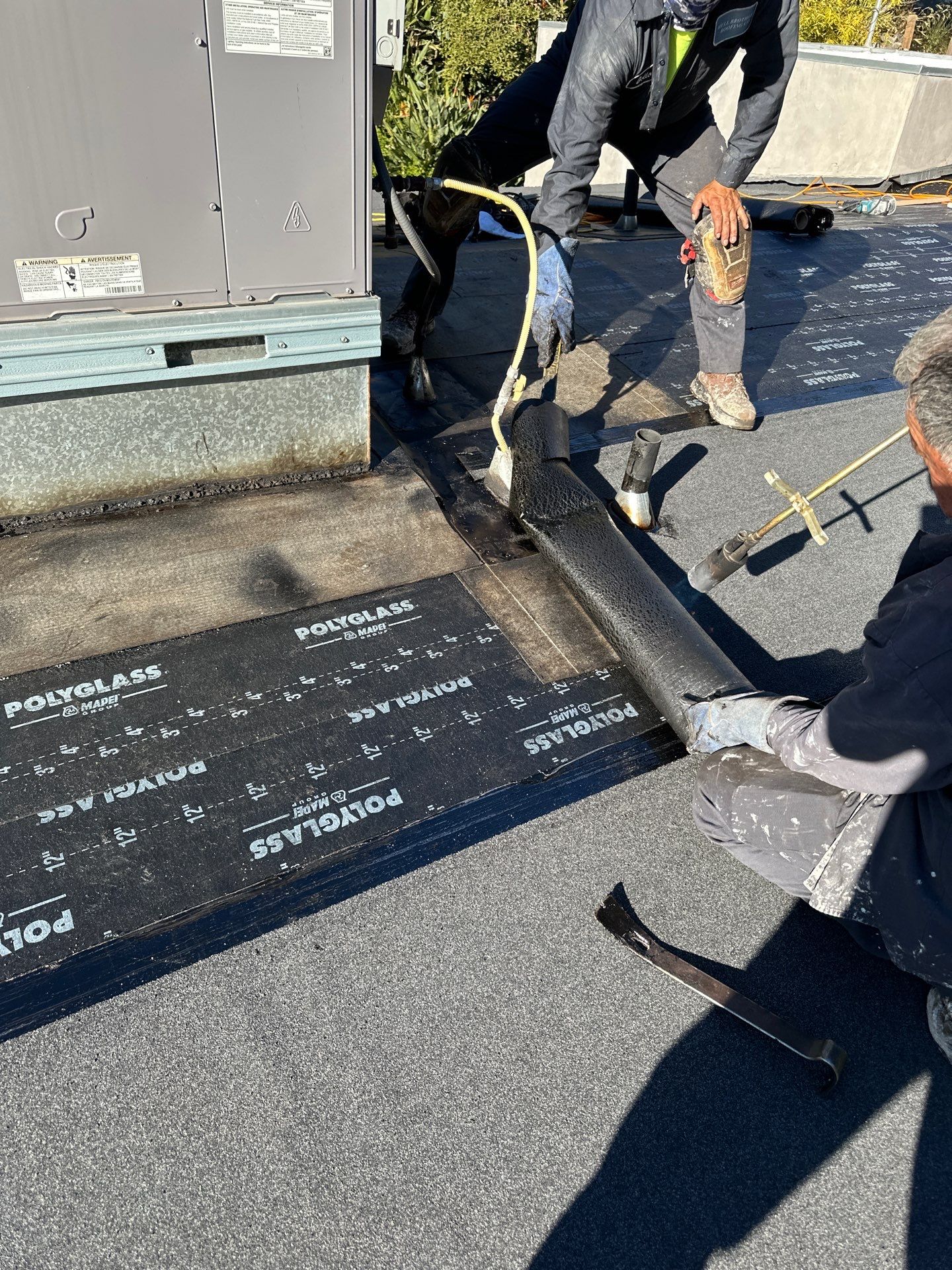 Residential Roofing Installation using Polyfresko® G Highly Reflective Modified Bitumen Cap Sheet by Hull Brothers Roofing