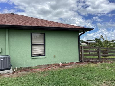 Musket brown downspouts with 6-inch K-Style gutter installation in Myakka City, FL