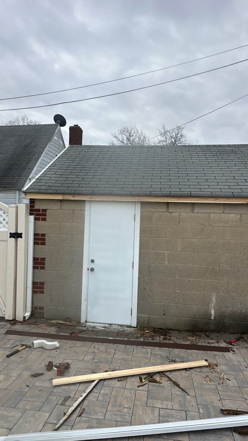 Queens Garage Fascia Rebuild + New 5" Seamless Gutter by Above All Gutters 