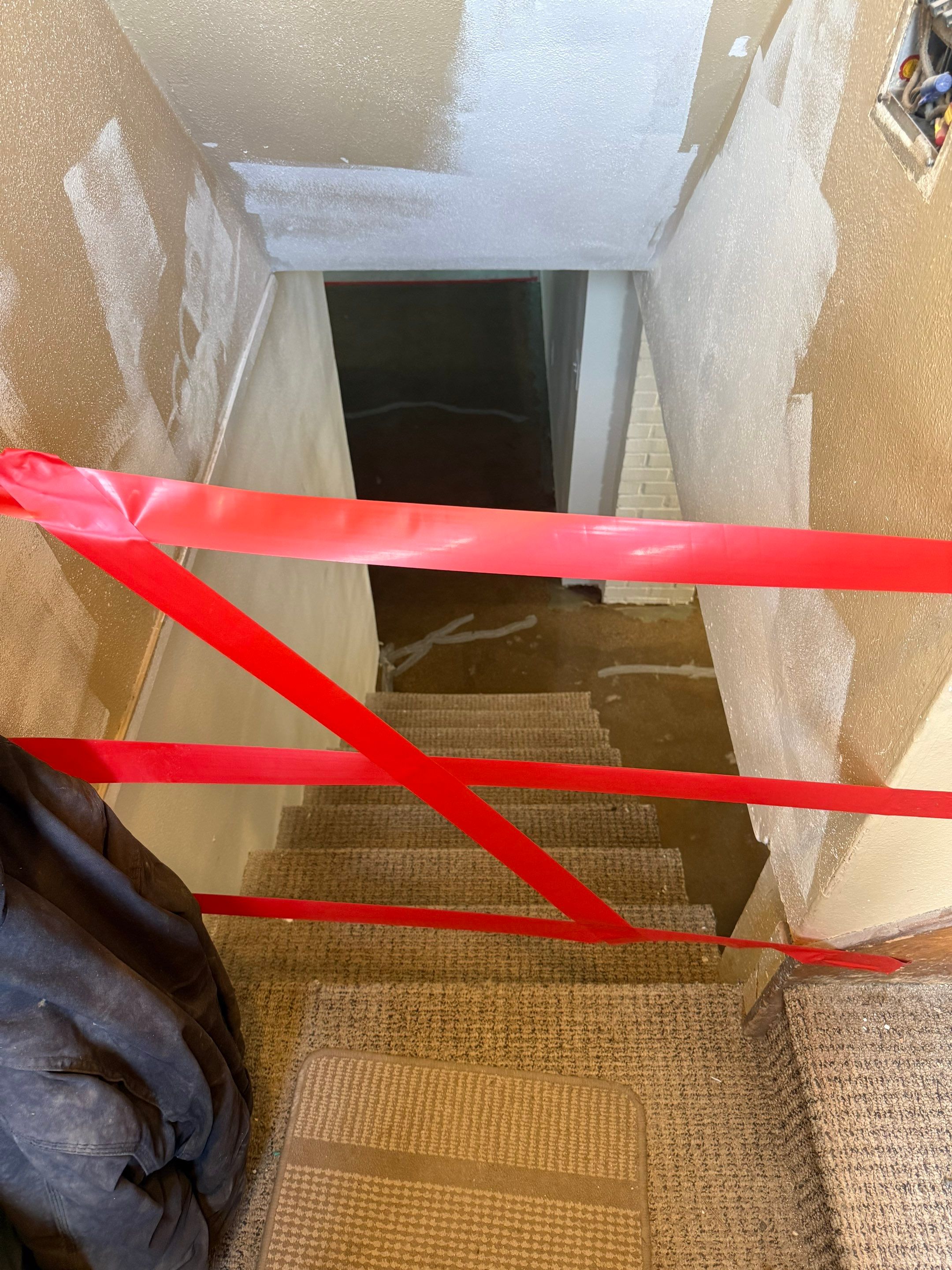High-Gloss Epoxy Floor Coating and Basement Renovation in Rock Rapids by Select Painting, Coatings & Garage Cabinets