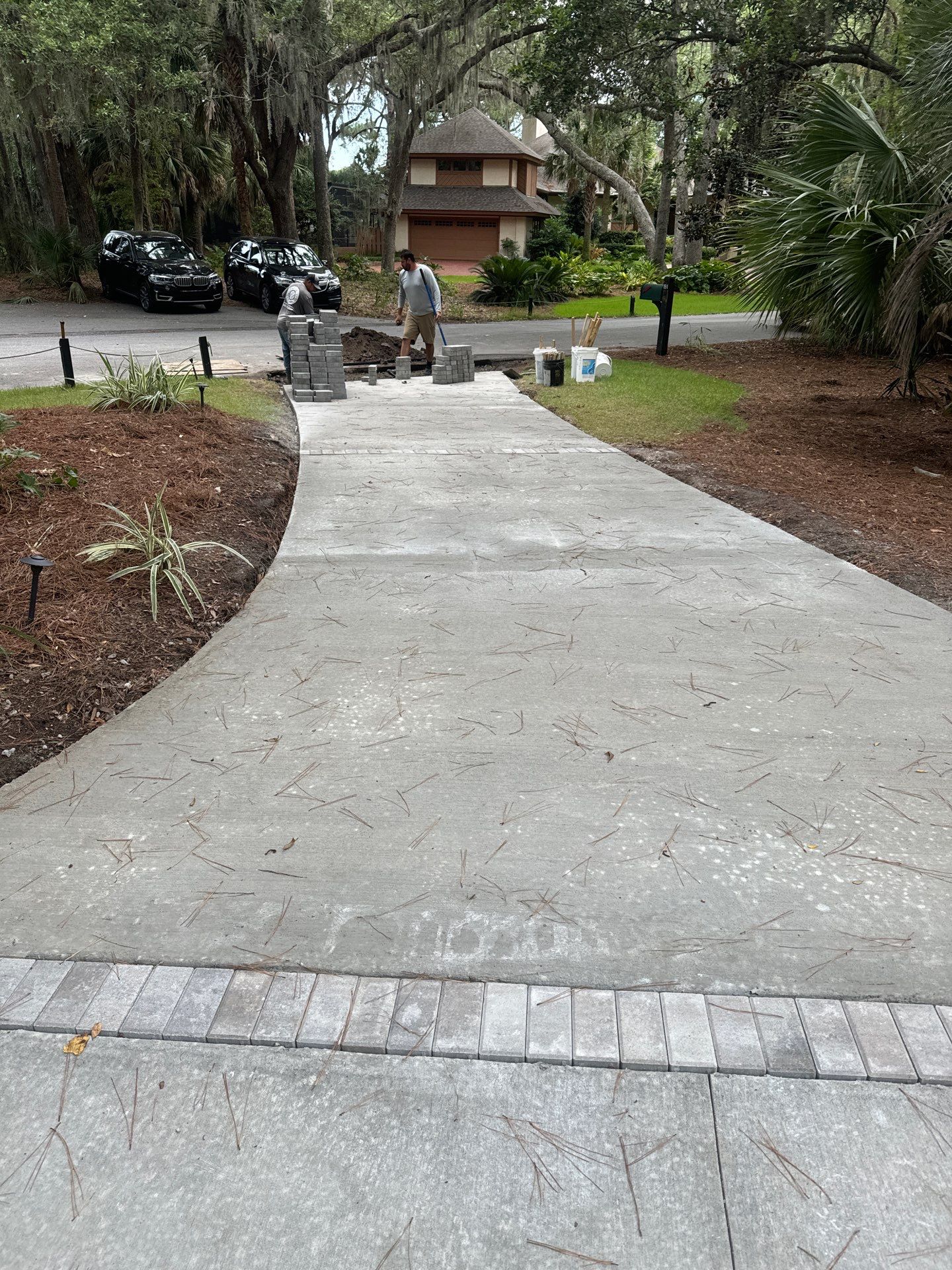 Hilton Head Island Concrete Driveway Replacement with Decorative Paver Borders by Lowcountry Scapes, LLC