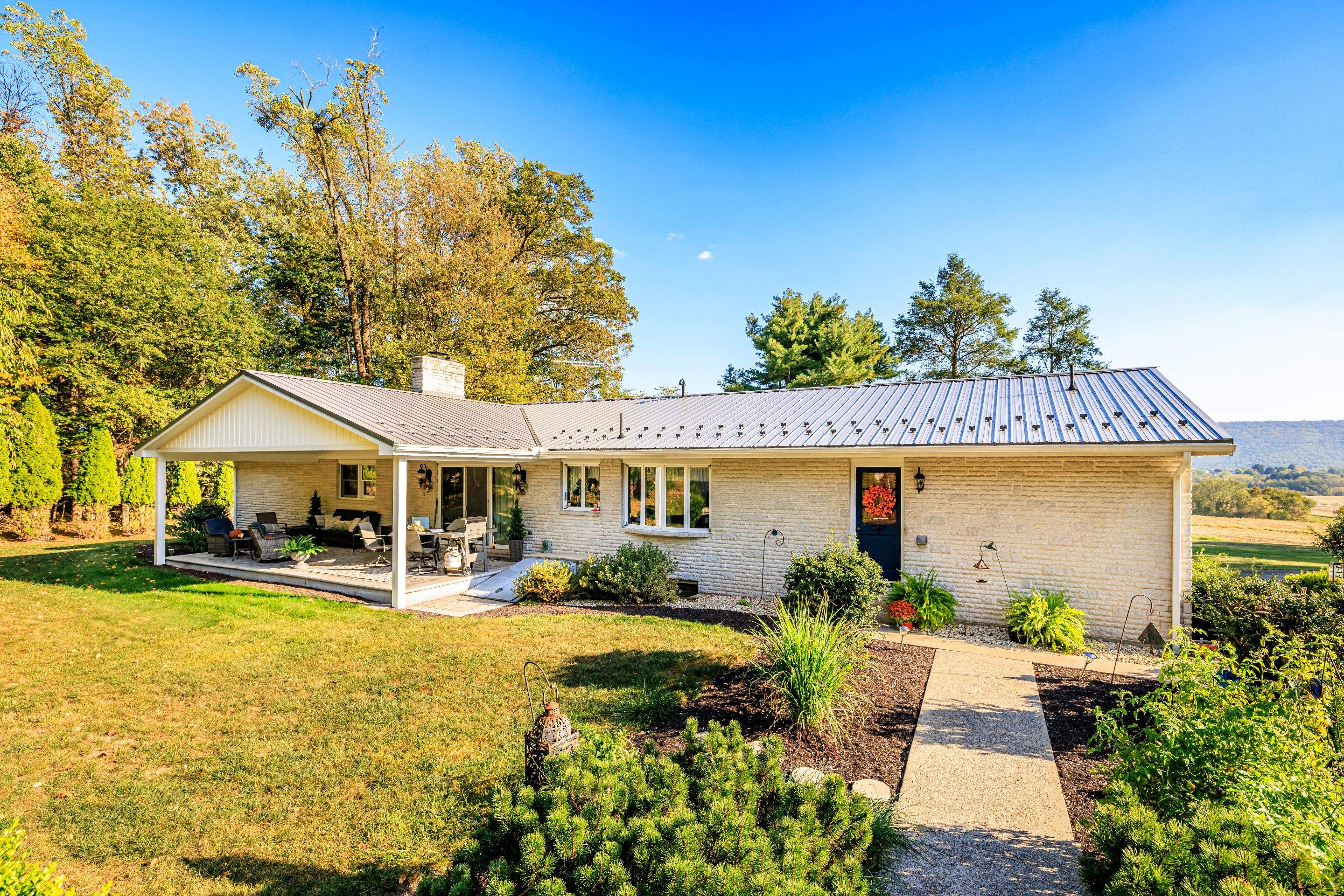 Metal Roof and Gabled Porch Addition in Hegins by Esh Builders