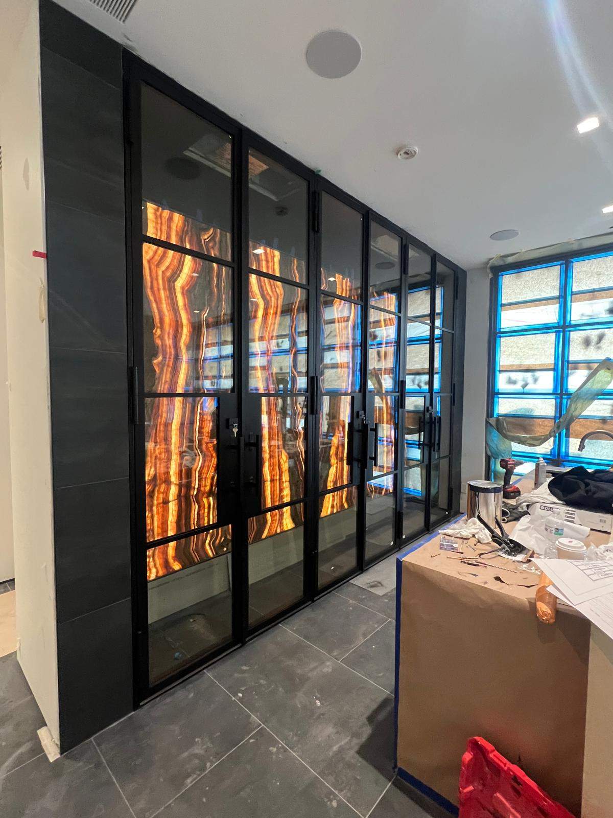 Custom Black-Framed Glass Wine Cellar Installation in Dallas by Solara Custom Living