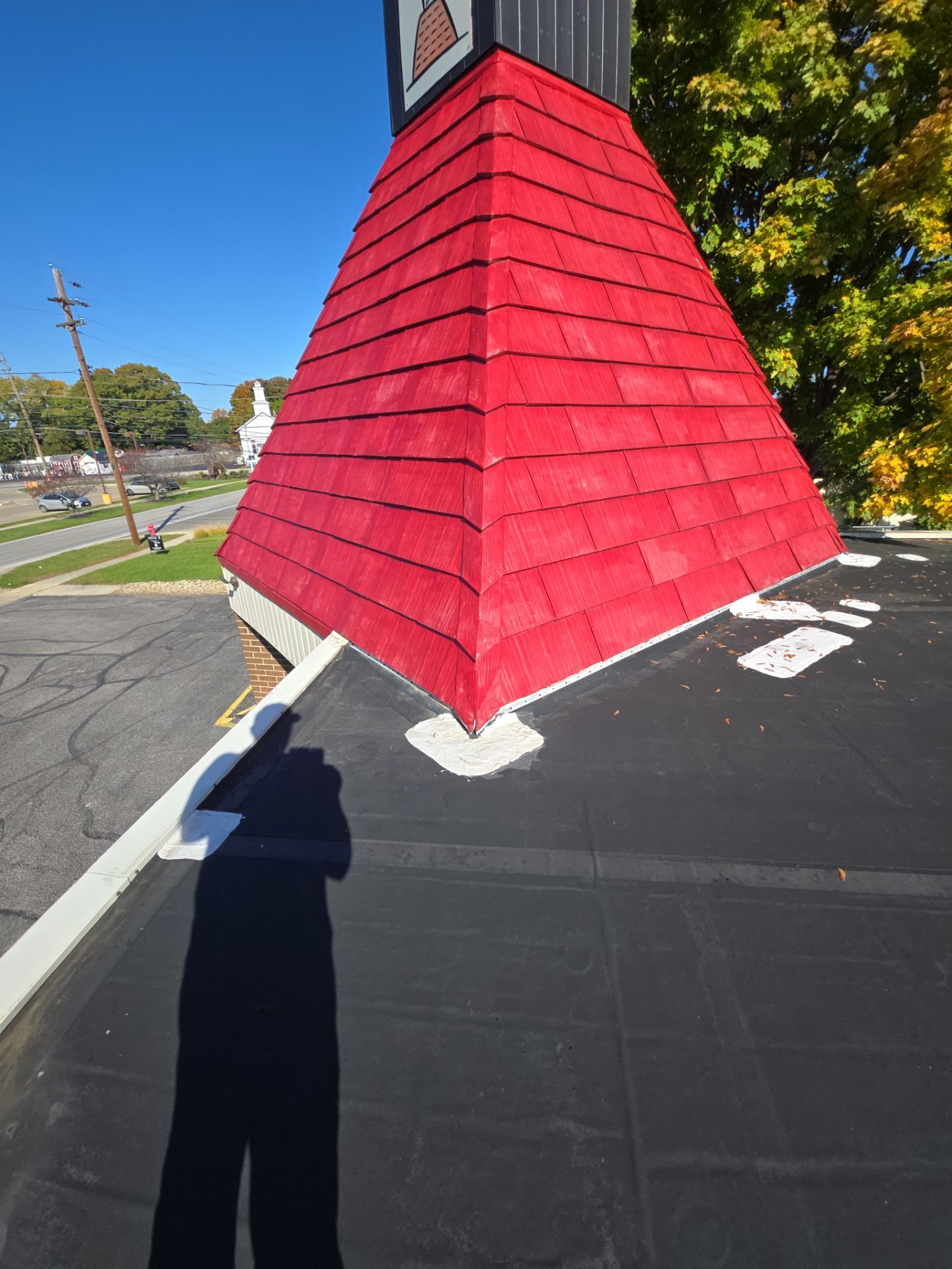 Commercial Roofing Repair using UniFlex Silicone Roof Coating on KinderCare Learning Center by 3 Daughters Construction 
