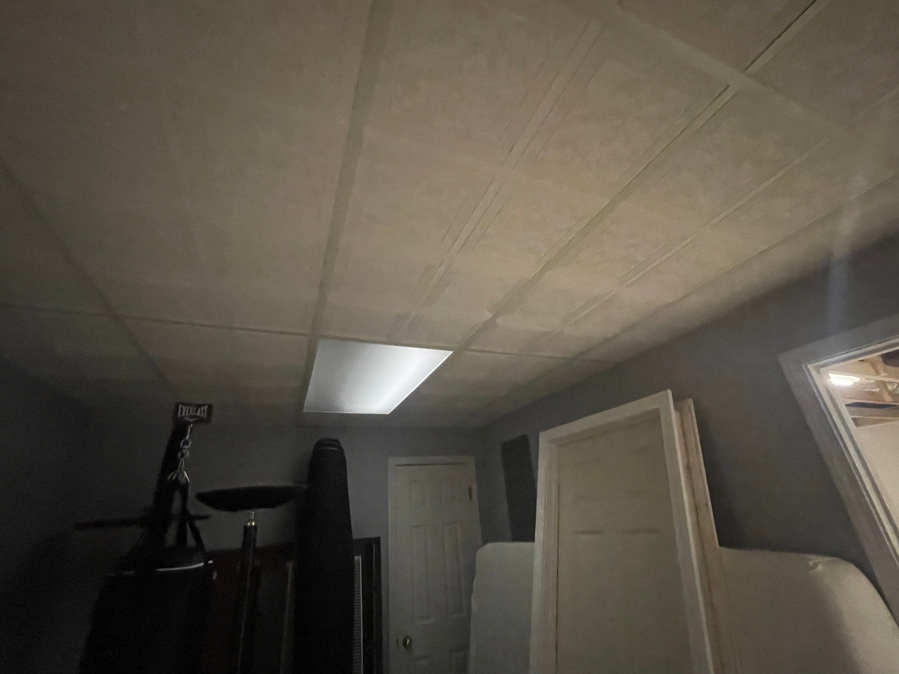 Finished Basement Room Transformation with Wood-Look Flooring in Roswell by Swift Home Renovations