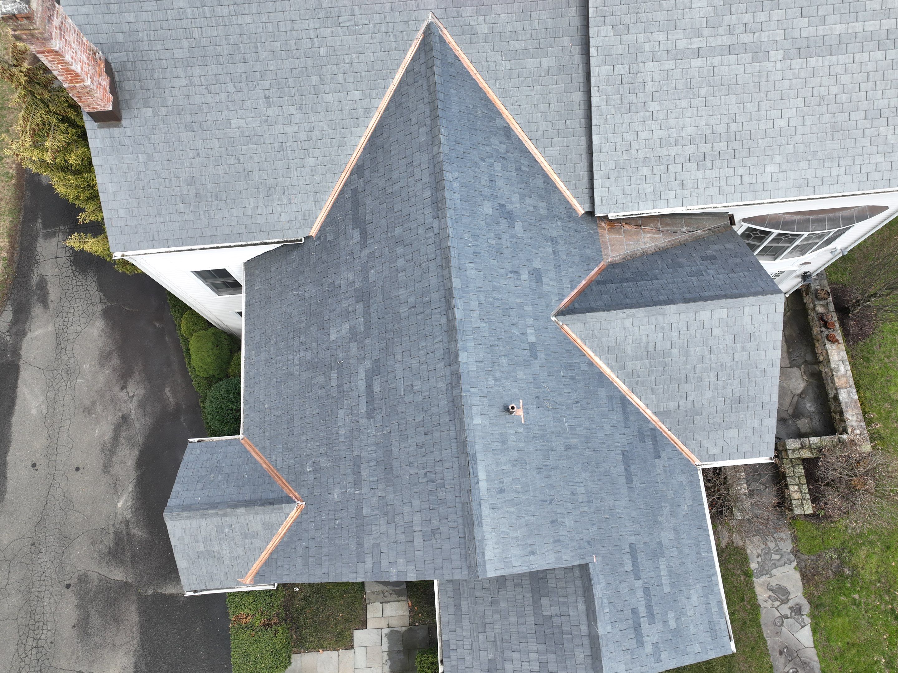 Residential Roofing Installation using Vermont Slate by A Plus Exterior
