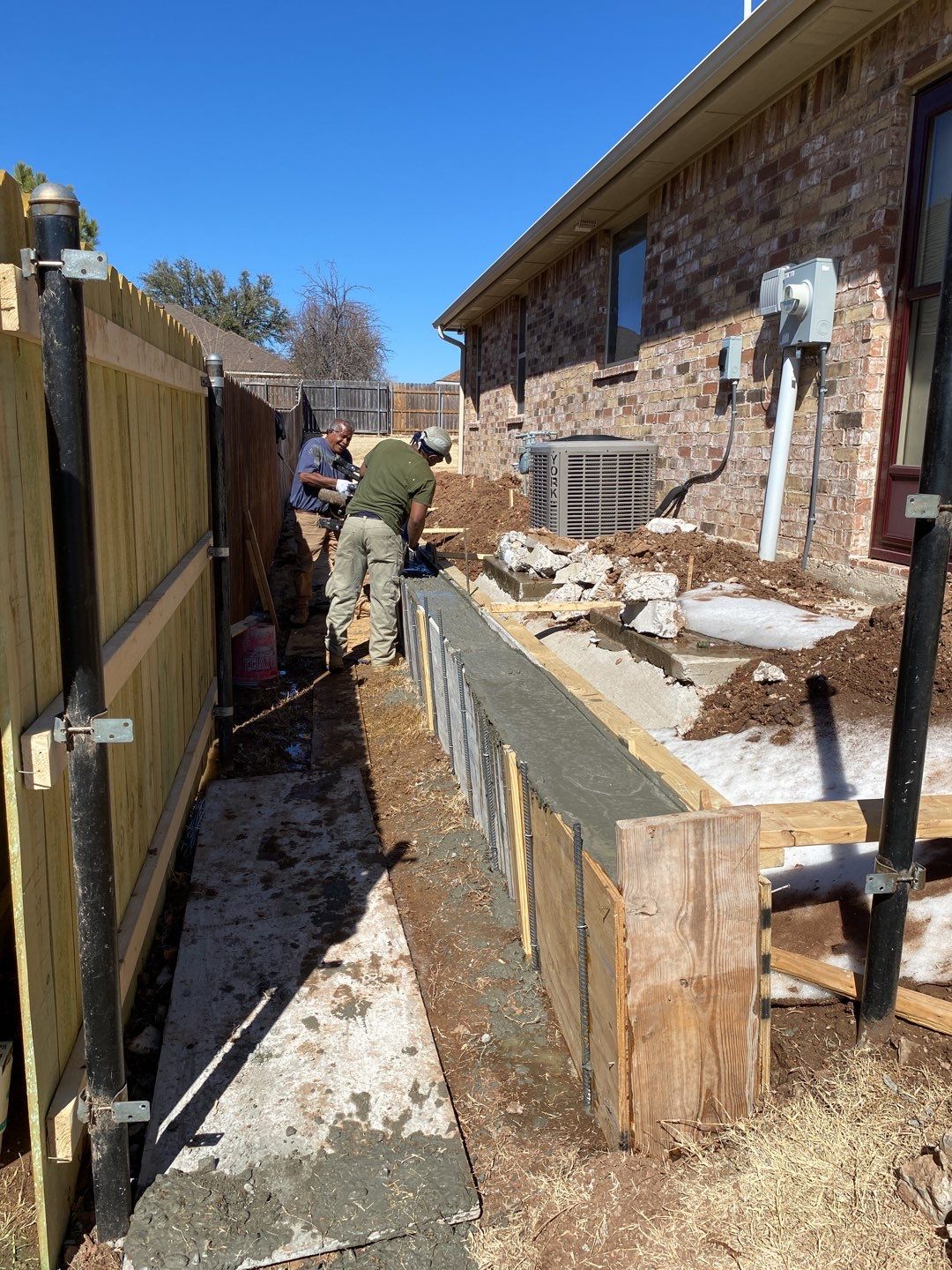 Concrete Slab , Retaining Wall , Fence, and landscape. by Clays Services Inc
