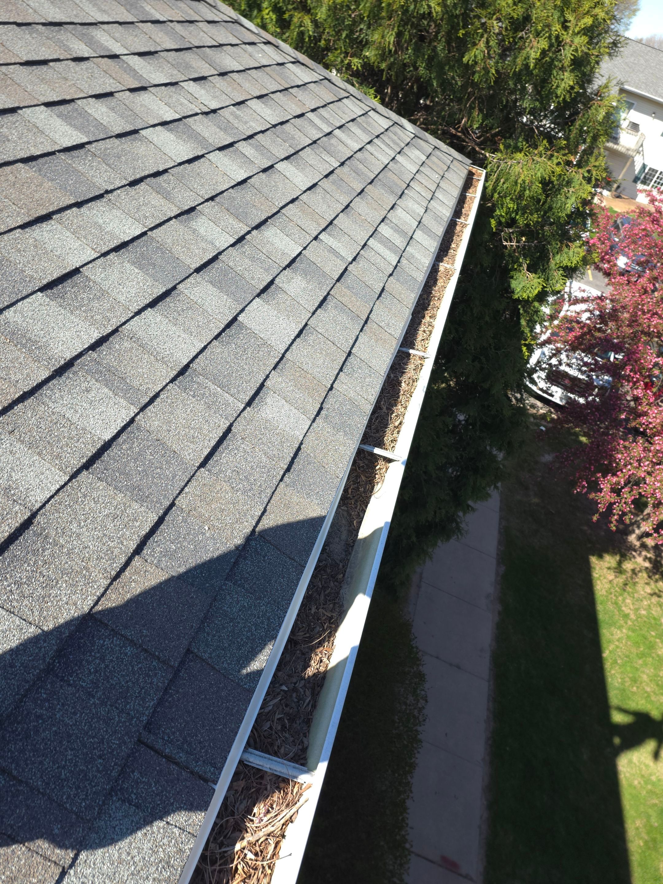 Commercial gutter cleaning Appleton & Oshkosh, WI before photo with filled gutters