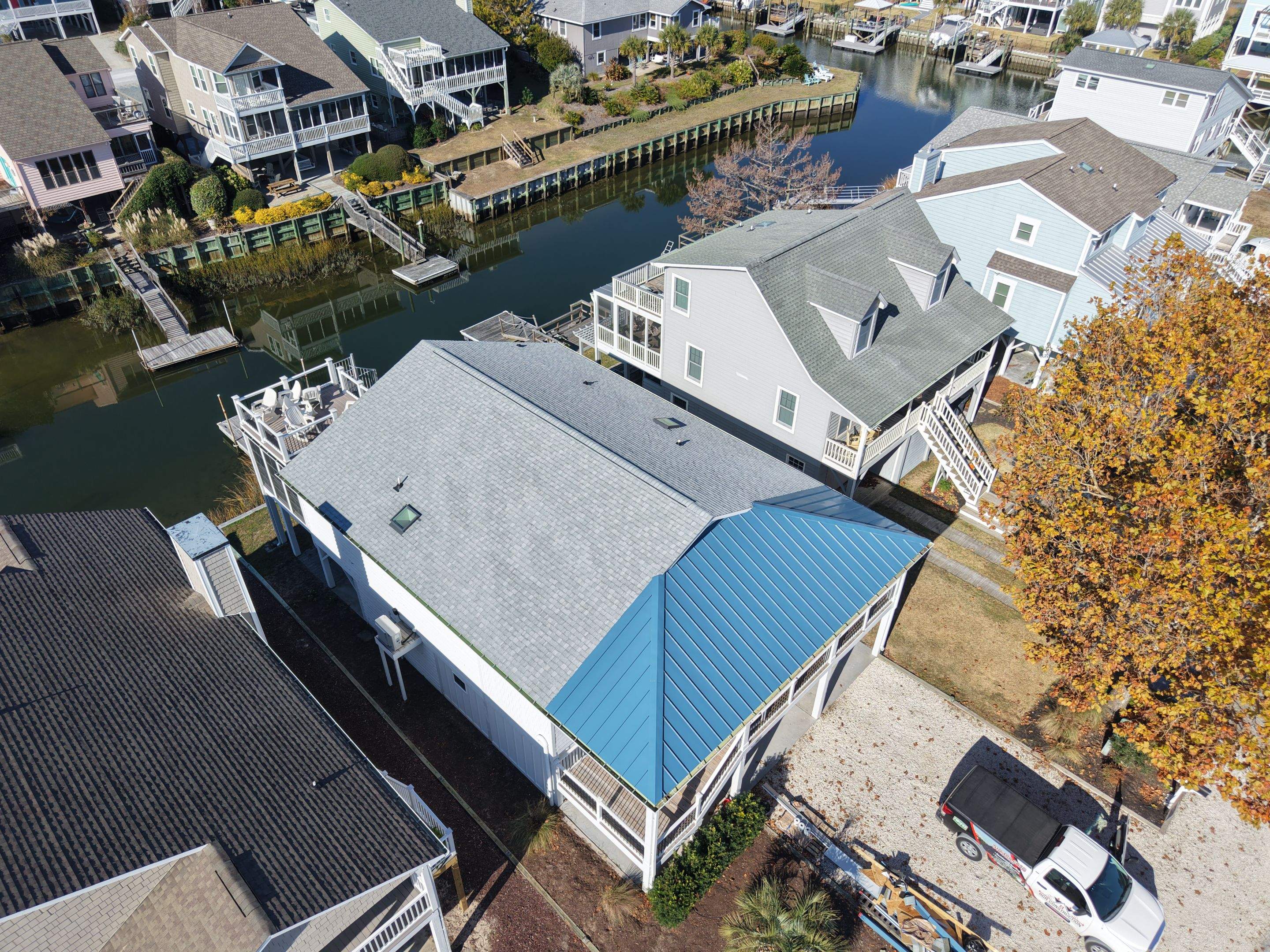 Standing Seam Metal Roof & Silver Birch Shingle Upgrade in Sunset Beach, NC by RGR Construction and Roofing, LLC