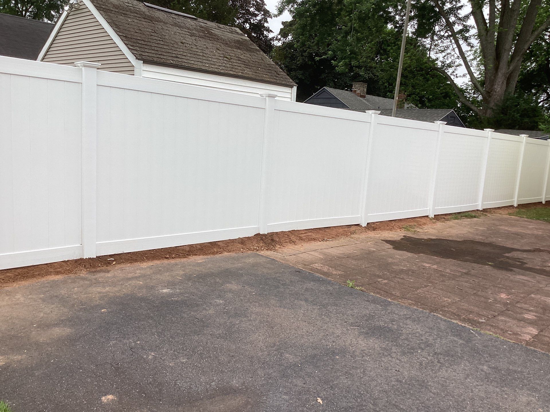 Replacement White Vinyl privacy Fence by DiGiorgi Roofing and Siding Inc