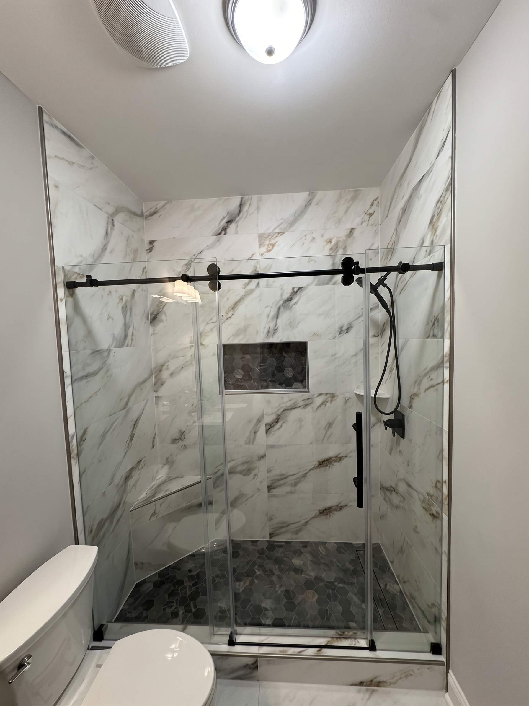 Three showers renovation by Prudencio