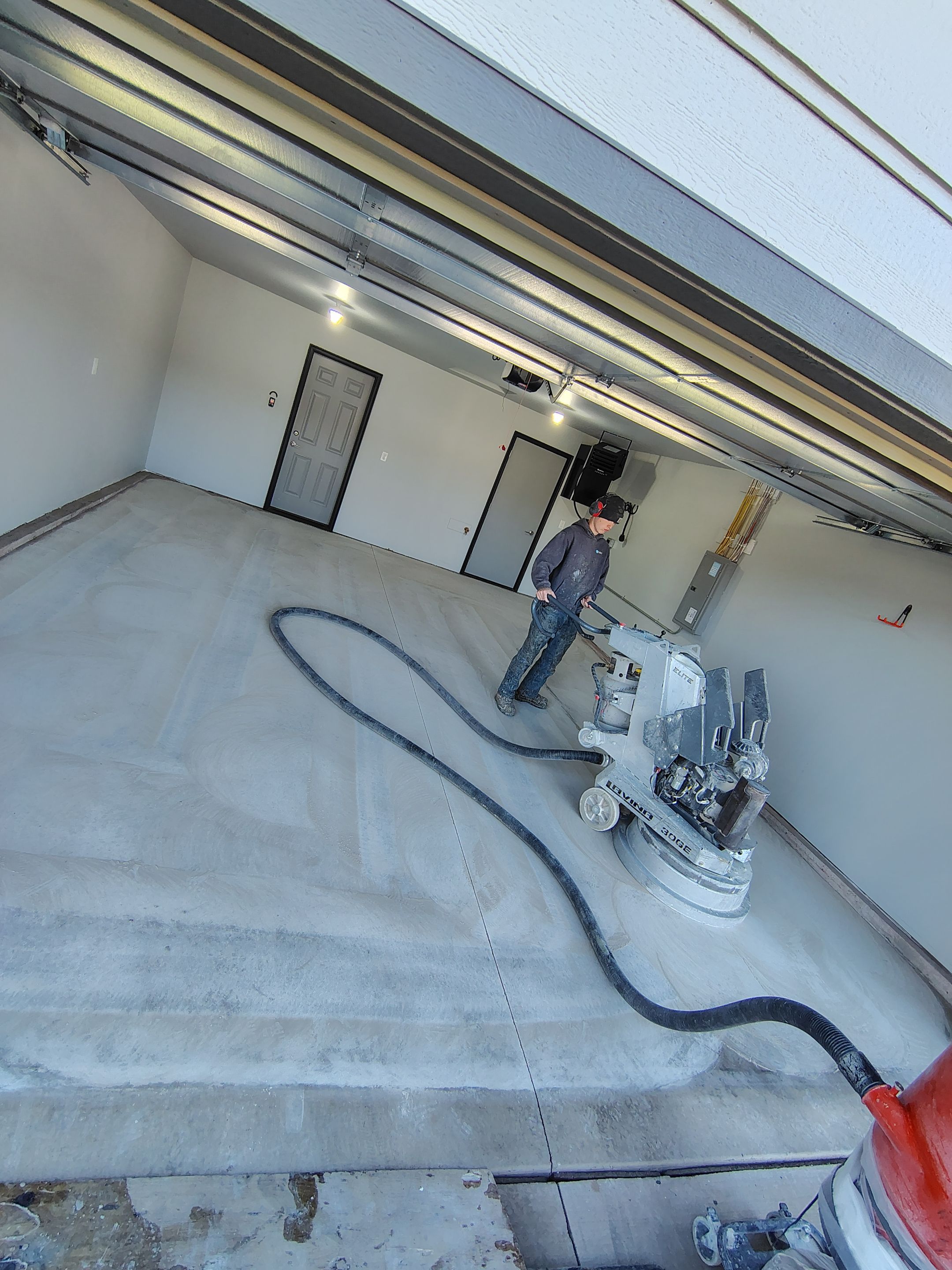Custom Epoxy Garage Floor Coating Installation in Sioux Falls by Select Painting, Coatings & Garage Cabinets