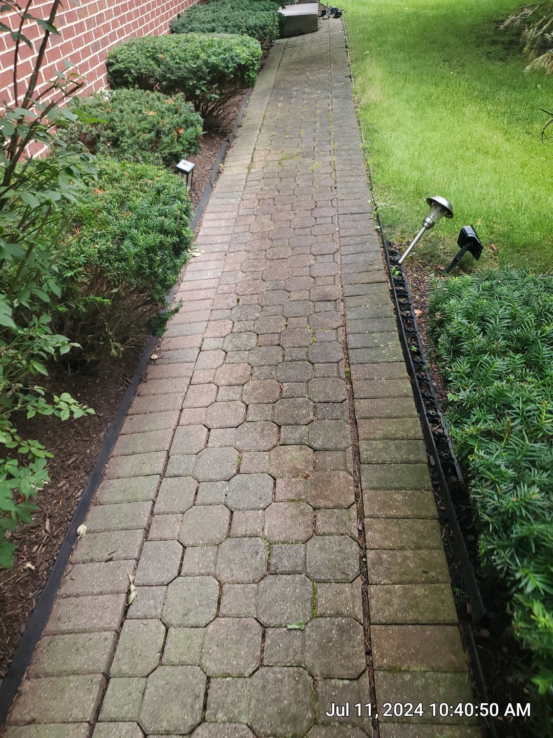 Brick paver repair, clean and seal by Northern Power Washing LLC.