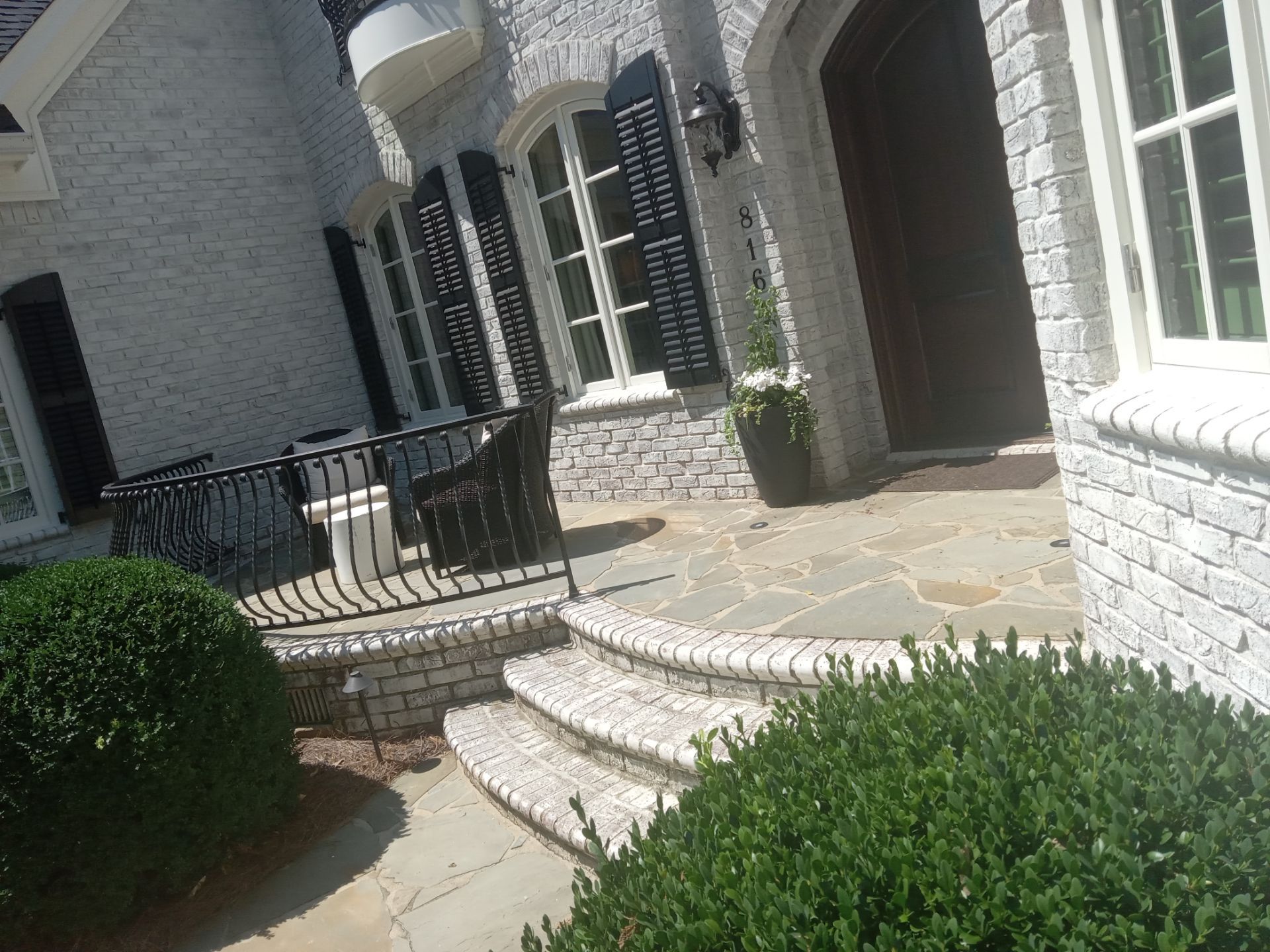 pressure washing exterior surfaces brick cleaning stone pathway refreshing house facade maintenance