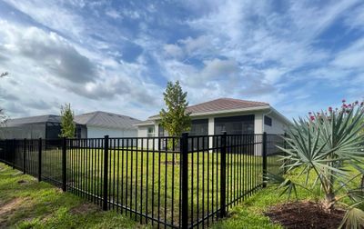Aluminum Fence Installation using Black 3 Rail Aluminum Fence