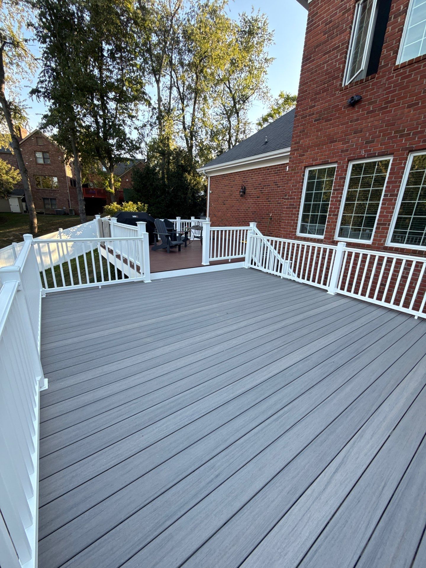 Deck extension  by Cousins Roofing Siding & Decks