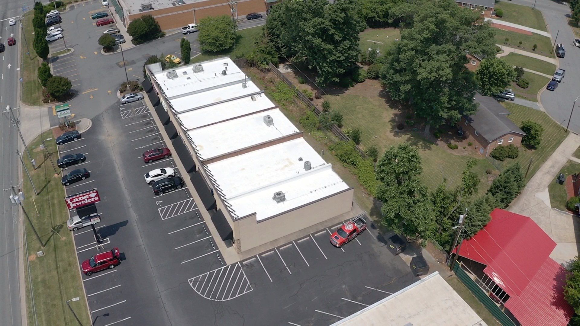 Commercial Roof Coating using Fiberseal basecoat and Silicon Topcoat by Just In Time Roofing and Restoration