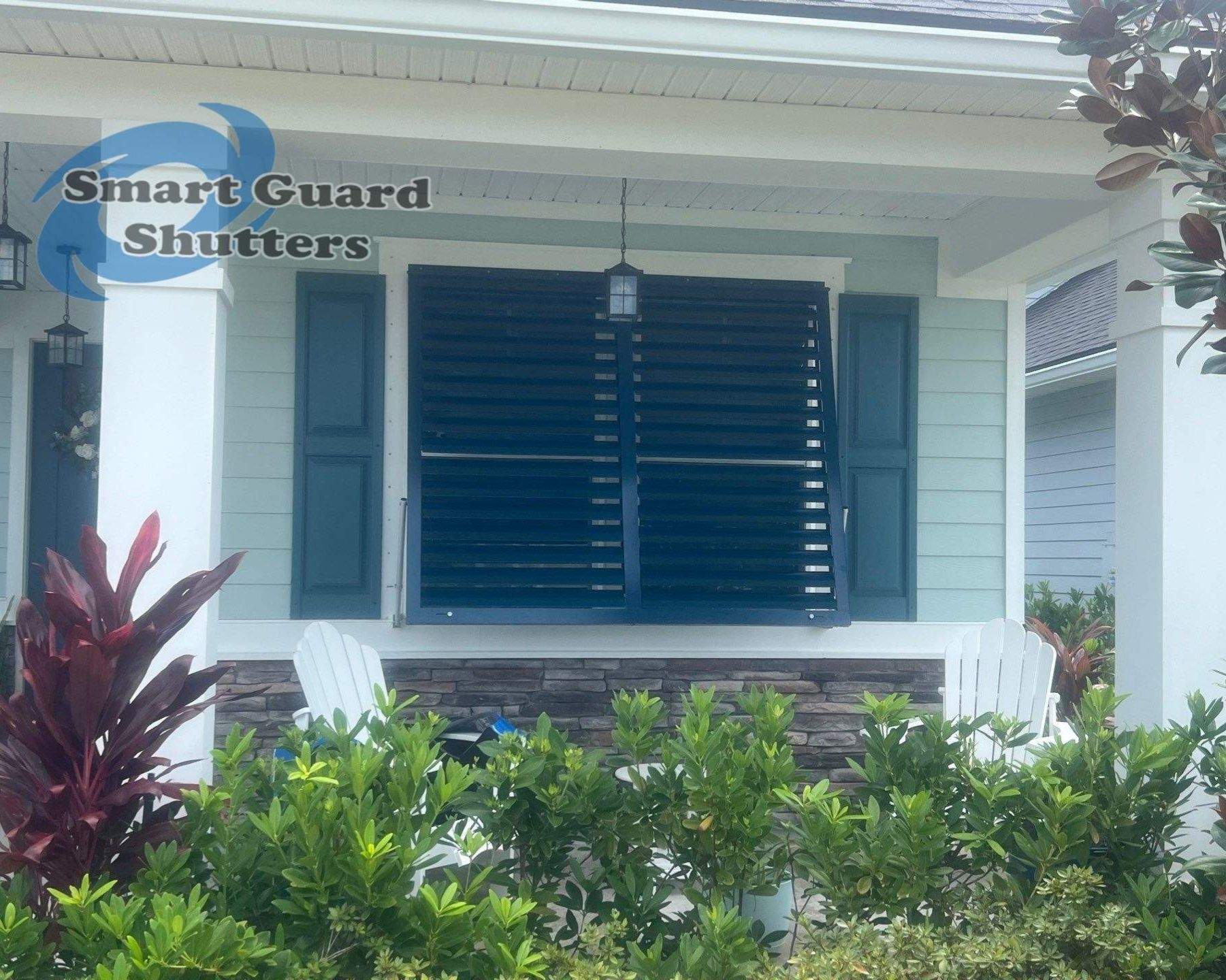 Impact Bahama Shutters in Ocean Blue by Smart Guard Shutters